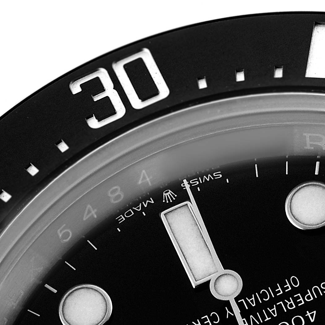 The image shows a close-up of the bezel and dial of the Rolex Sea-Dweller 126600 Men's Stainless Steel Black Dial, highlighting the number "30" and hour markers.