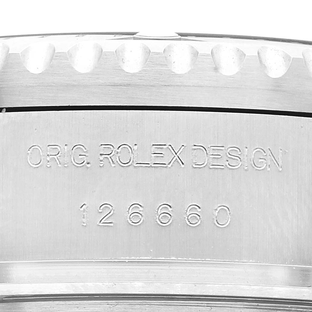 The image shows a close-up of the engraved case back of a Rolex Sea-Dweller 126660 Men
s Stainless Steel Black Dial 126660 Men
s Stainless Steel Black Dial, including its model number 126660.