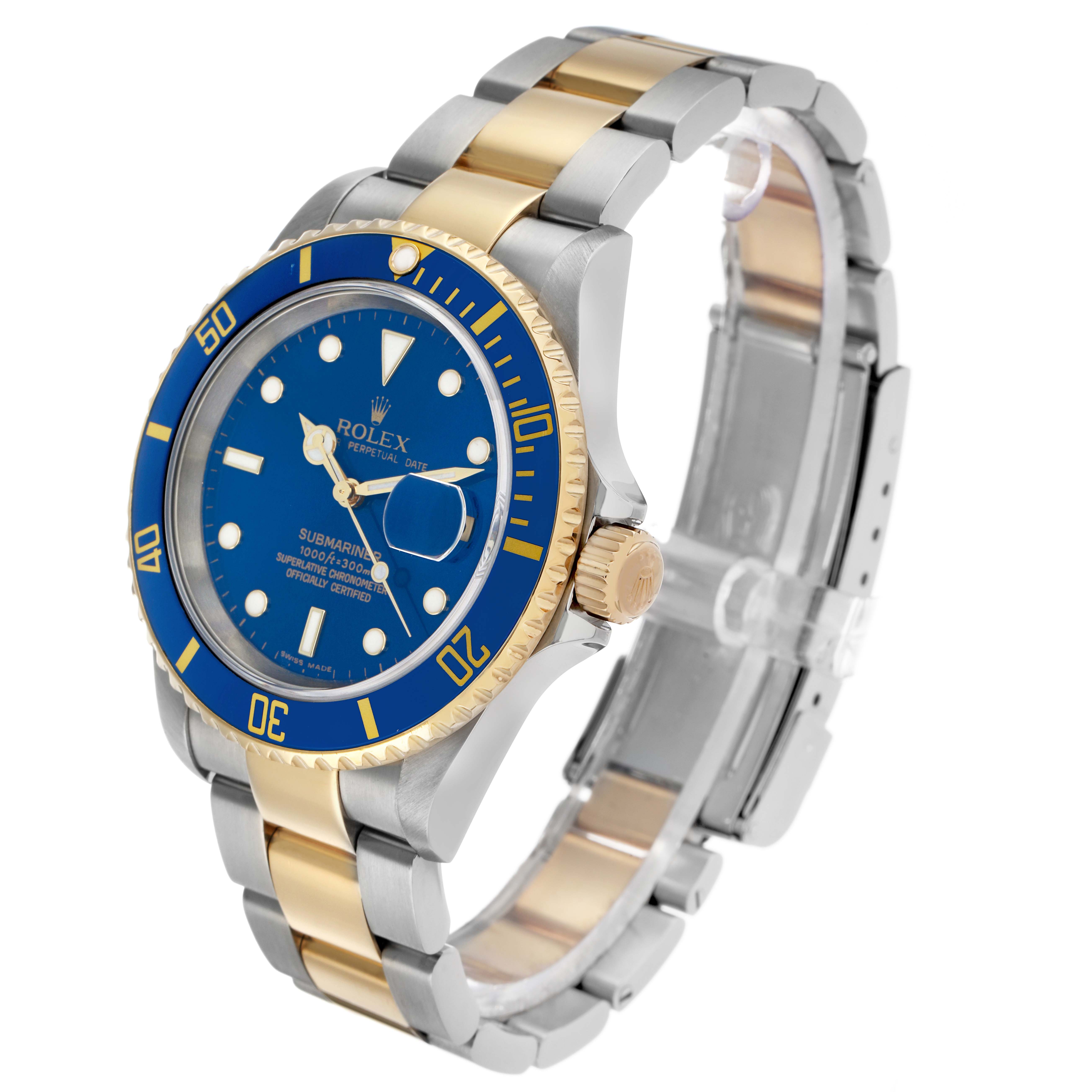 The Rolex Submariner 16613 Men's Steel and Gold (two tone) Blue Dial is shown at a three-quarter angle, highlighting its blue dial, gold bezel, and two-tone bracelet.