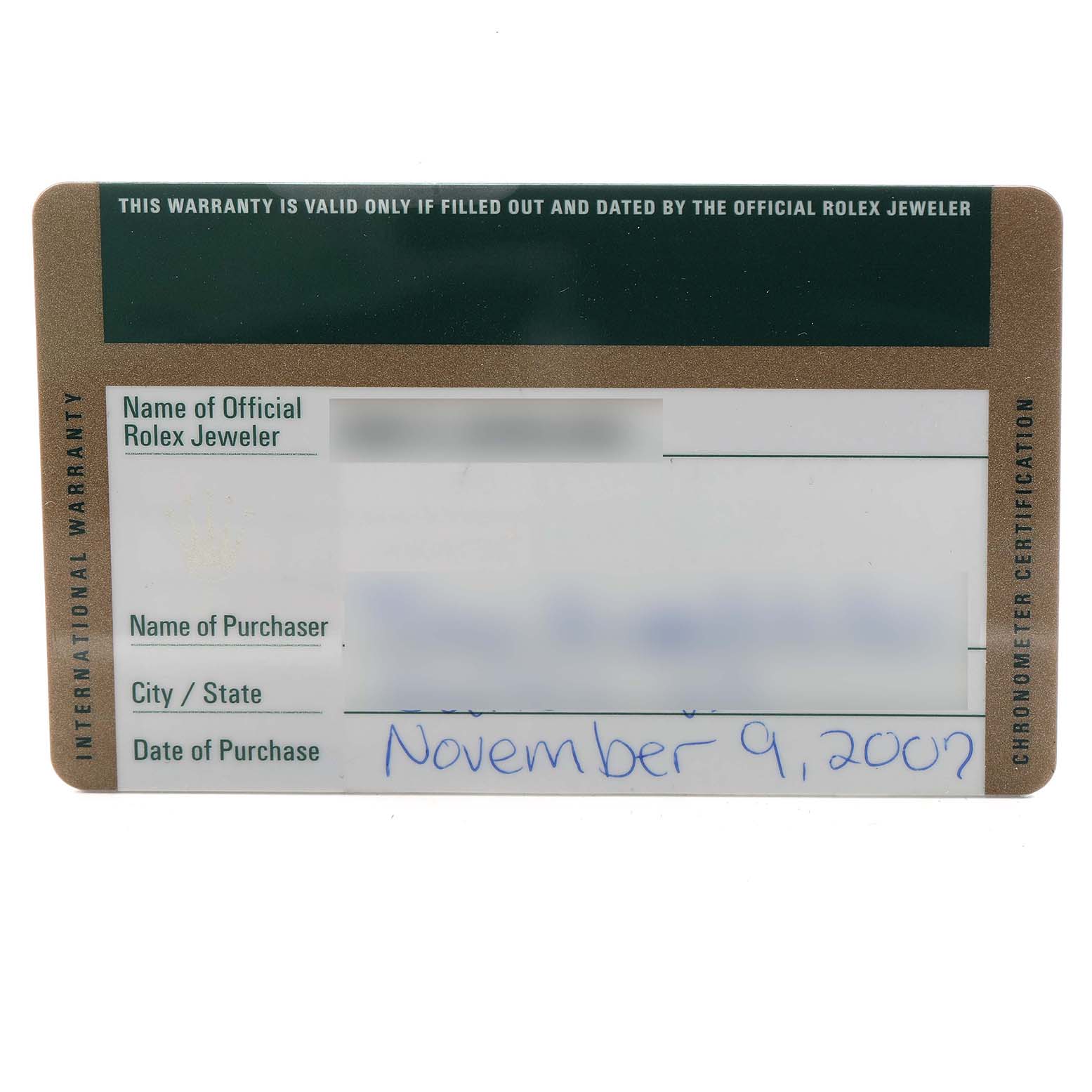 The image shows a horizontal, close-up view of a Rolex Submariner 16613 Men's Steel and Gold (two tone) Blue Dial warranty card.