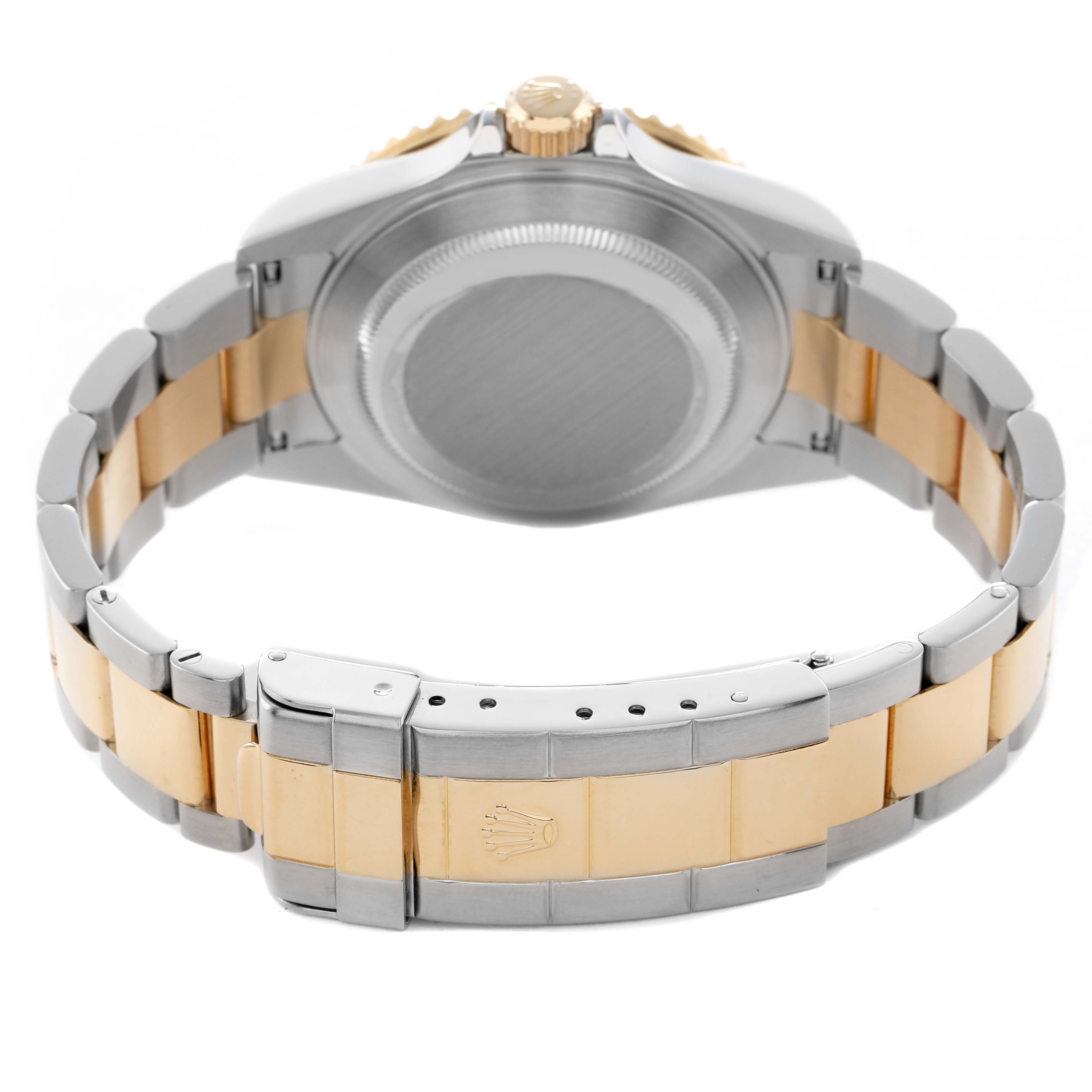 The image shows the back side of a Rolex Submariner 16613 Men's Steel and Gold (two tone) Blue Dial watch, highlighting the case back, crown, and two-tone bracelet.