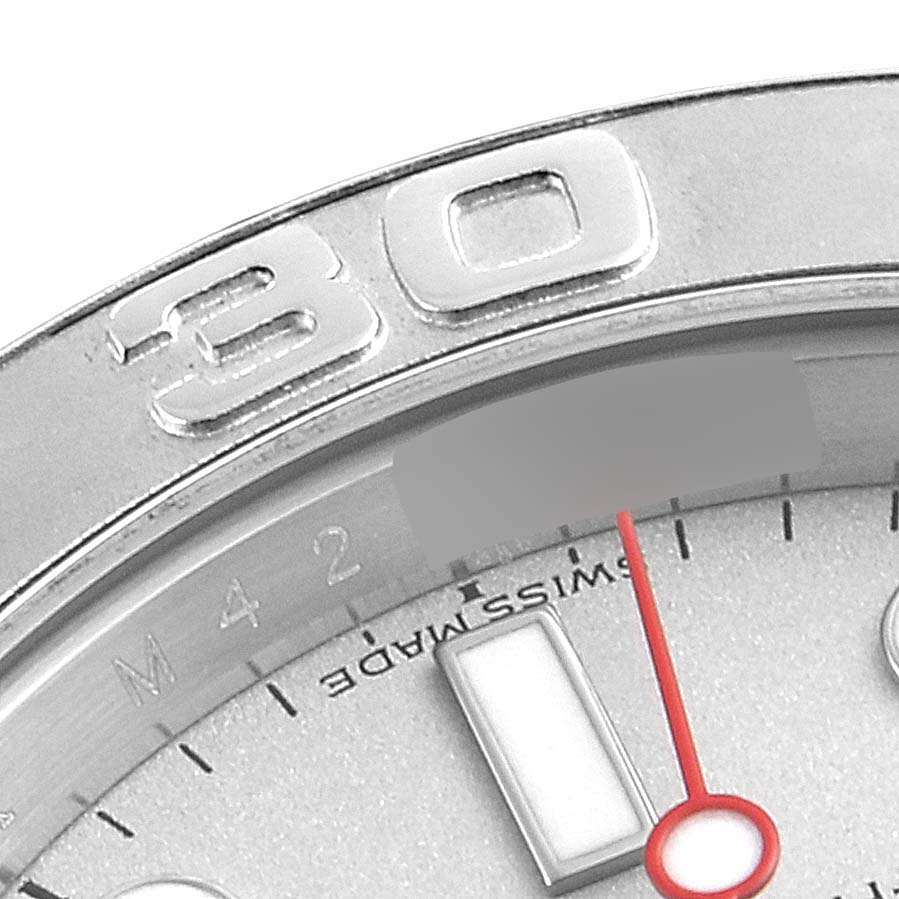 This close-up image shows a portion of the bezel and dial of a Rolex Yacht-Master 16622 Men
s Stainless Steel Silver Dial 16622 Men
s Stainless Steel Silver Dial watch, including the "30" marker and the seconds hand.