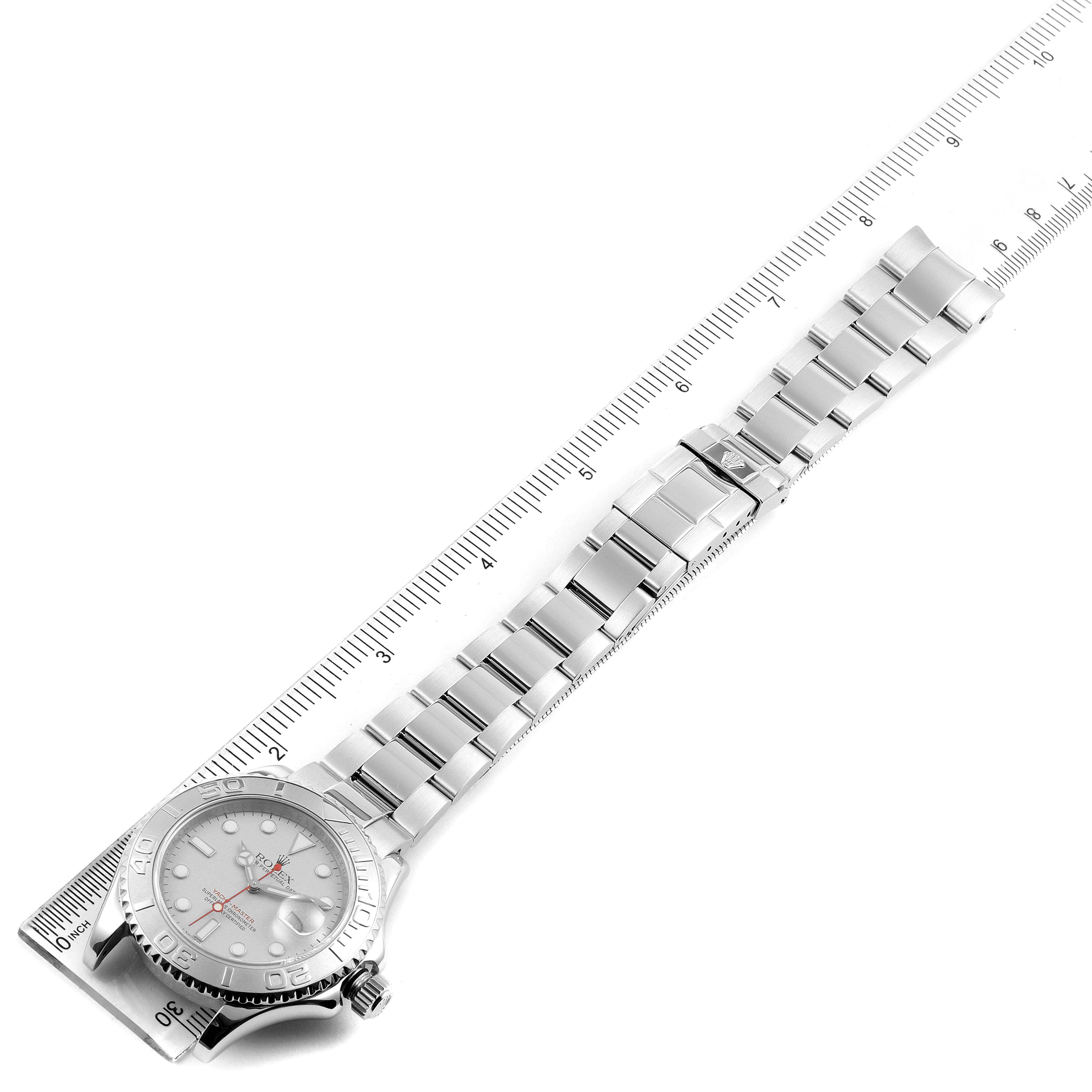 The image shows the Yacht-Master watch by Rolex from an angled top view, displaying the face, bezel, and metal bracelet.