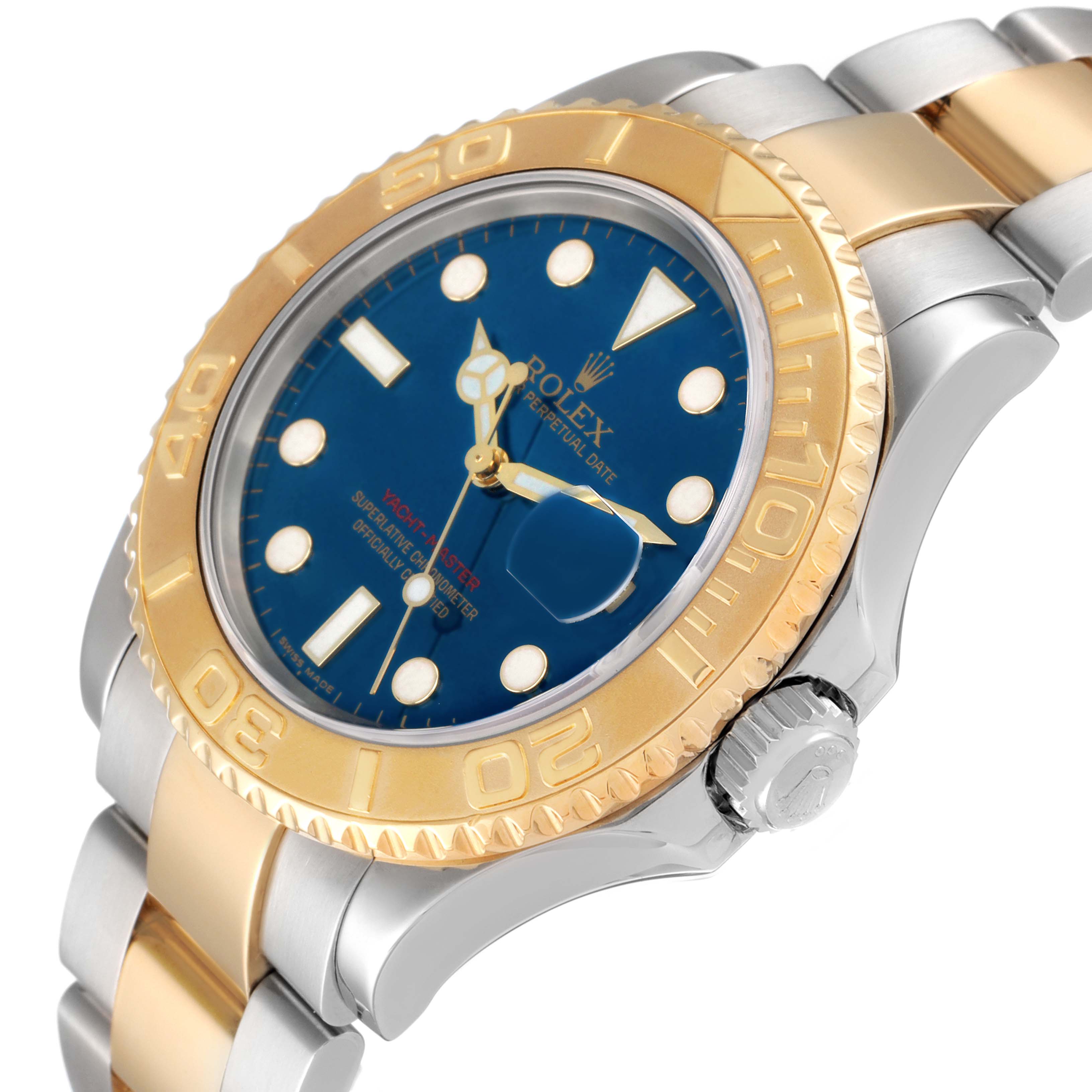 The Rolex Yacht-Master 16623 Men
s Steel and Gold (two tone) Blue Dial watch is shown at a slight angle, highlighting the gold bezel, blue dial, crown, and two-tone bracelet.