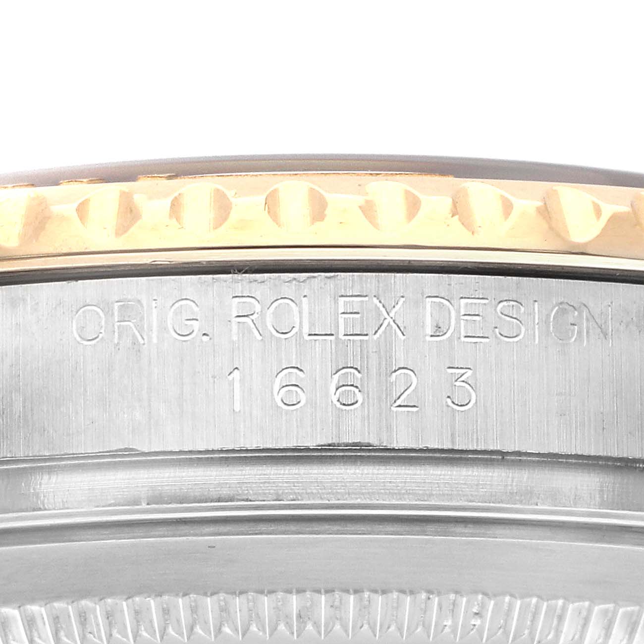 The image shows the side of a Rolex Yacht-Master 16623 Men
s Steel and Gold (two tone) Blue Dial watch, highlighting the engraved model number "16623" and "ORIG. ROLEX DESIGN."