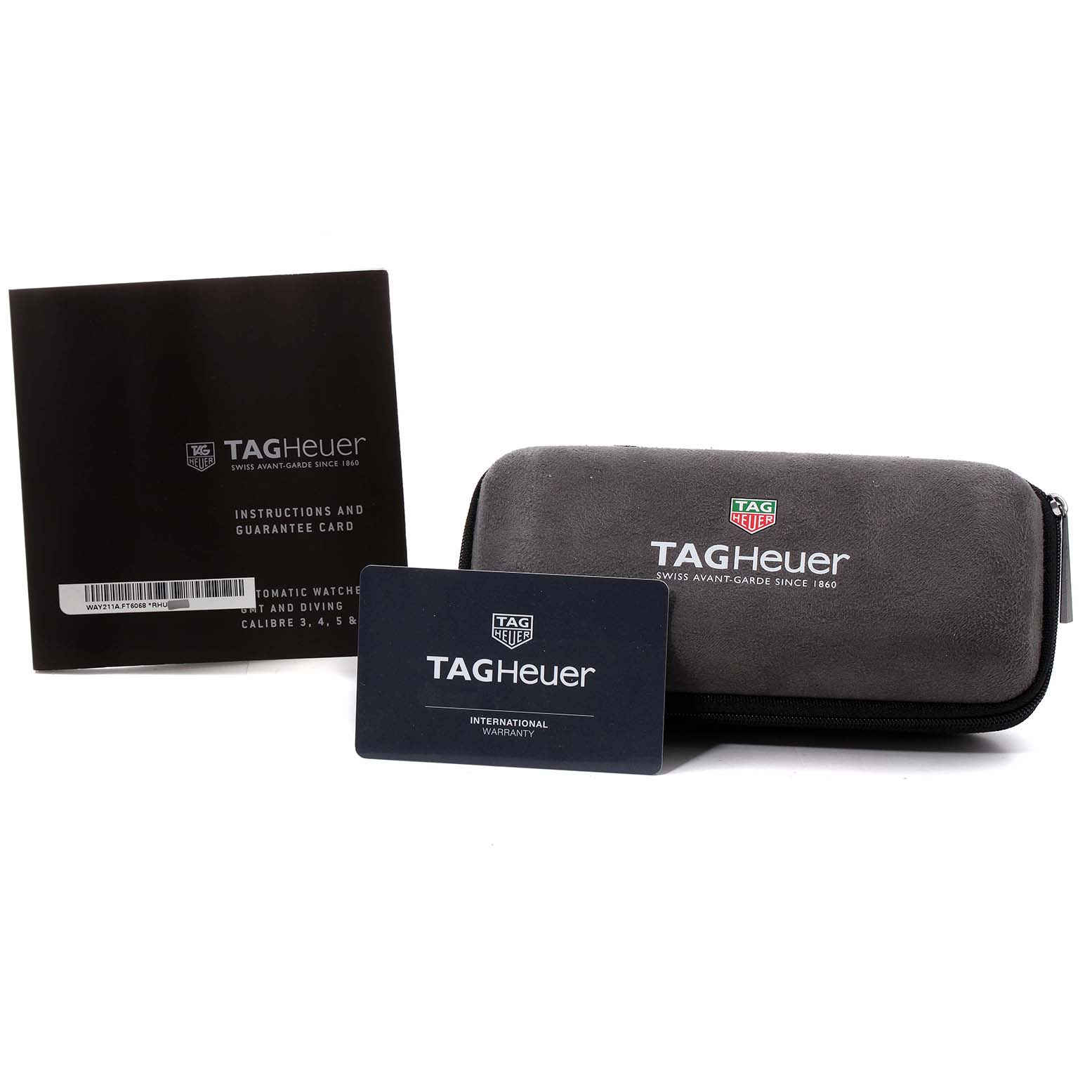 The image shows a Tag Heuer Aquaracer WAY211A Men's Stainless Steel Black Dial WAY211A Men's Stainless Steel Black Dial watch case, instructions booklet, and international warranty card from a side angle.