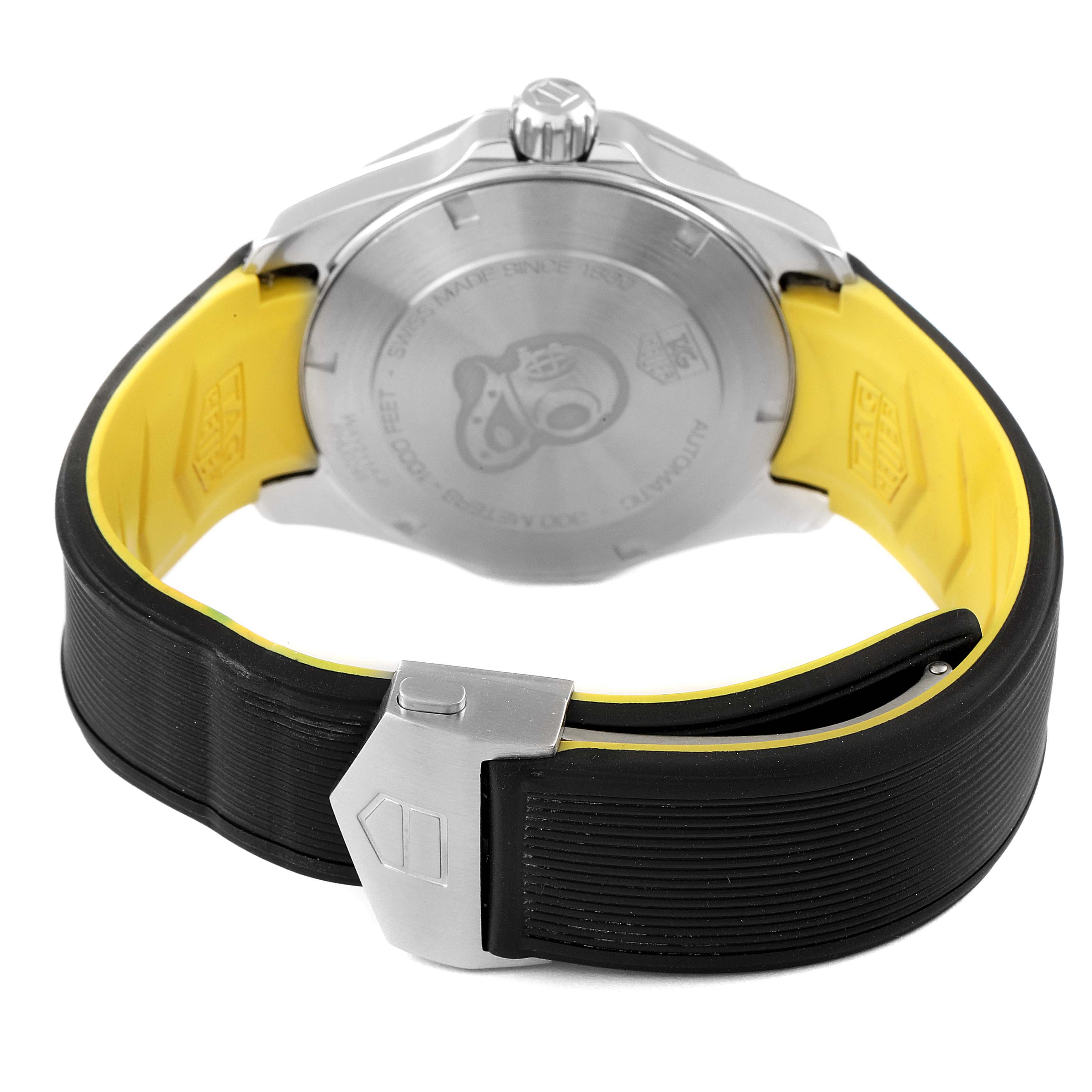 The image shows the back of the Tag Heuer Aquaracer WAY211A Men's Stainless Steel Black Dial WAY211A Men's Stainless Steel Black Dial watch along with its closed clasp and yellow-black strap.