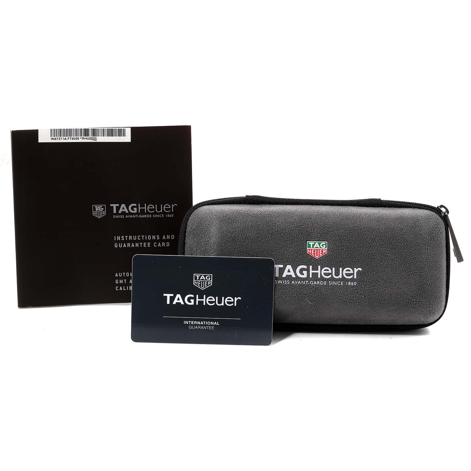 This image shows a Tag Heuer Aquaracer WAY211A Men's Stainless Steel Black Dial WAY211A Men's Stainless Steel Black Dial watch case, instructions manual, and an international guarantee card from a frontal angle.