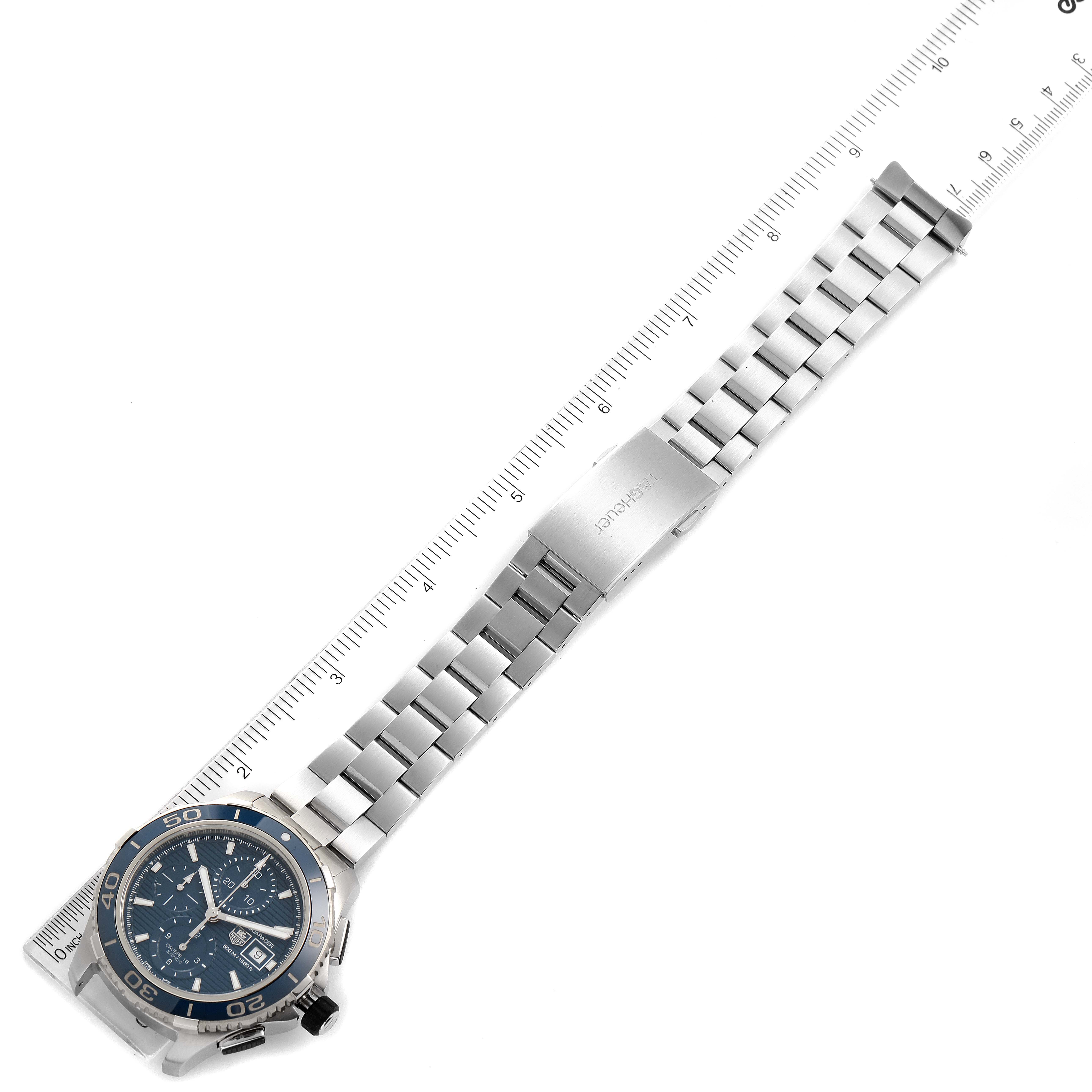 The image shows a Tag Heuer Aquaracer CAK2112.BA0833 Men
s Stainless Steel Blue Dial CAK2112.BA0833 Men
s Stainless Steel Blue Dial watch laid flat with its band extended alongside a ruler for size reference.