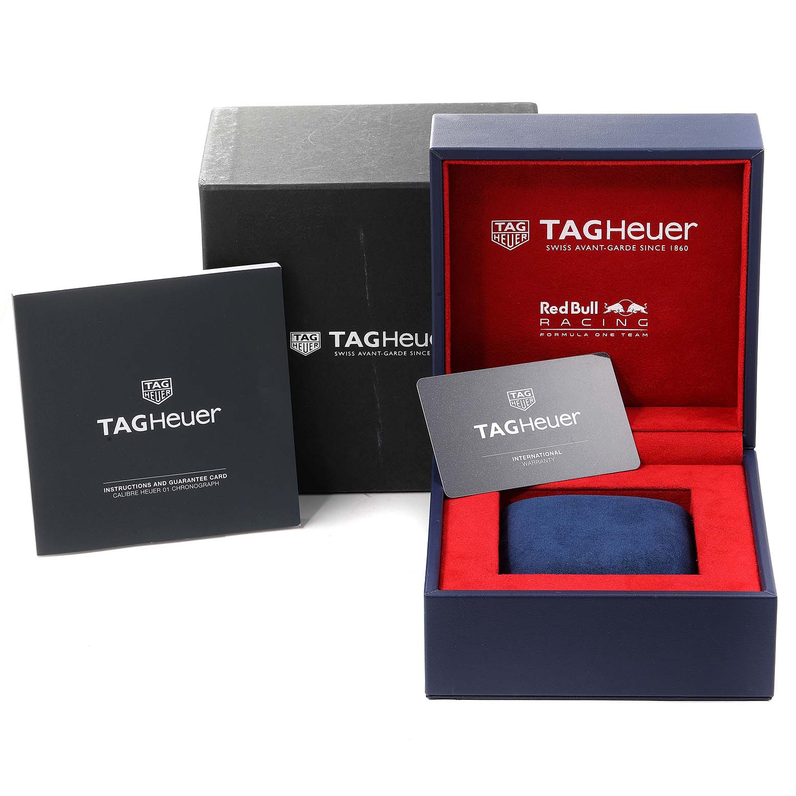 The image shows the packaging, guarantee card, and instruction booklet for the Tag Heuer Carrera CAR2A1K.BA0703 Men
s Stainless Steel Blue Dial CAR2A1K.BA0703 Men
s Stainless Steel Blue Dial model watch.