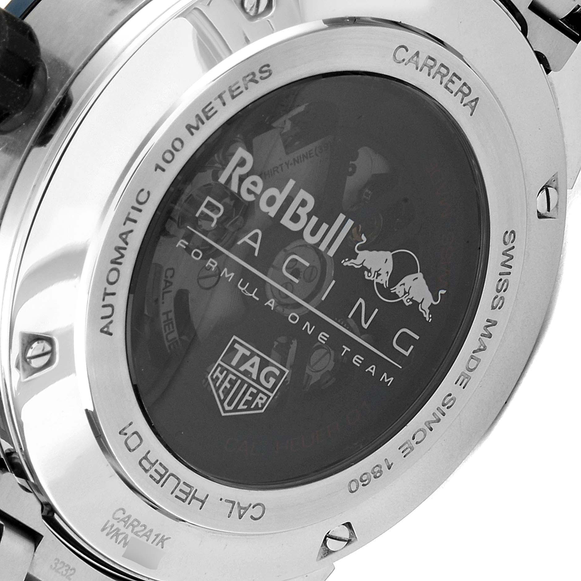 The image shows the back case of a Tag Heuer Carrera CAR2A1K.BA0703 Men
s Stainless Steel Blue Dial CAR2A1K.BA0703 Men
s Stainless Steel Blue Dial watch, displaying the Red Bull Racing logo and other engraving details.