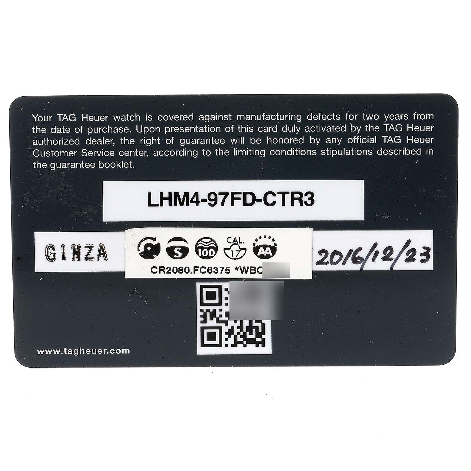 The image shows a TAG Heuer warranty card for a Monza model watch, featuring serial numbers, a QR code, and a purchase date.