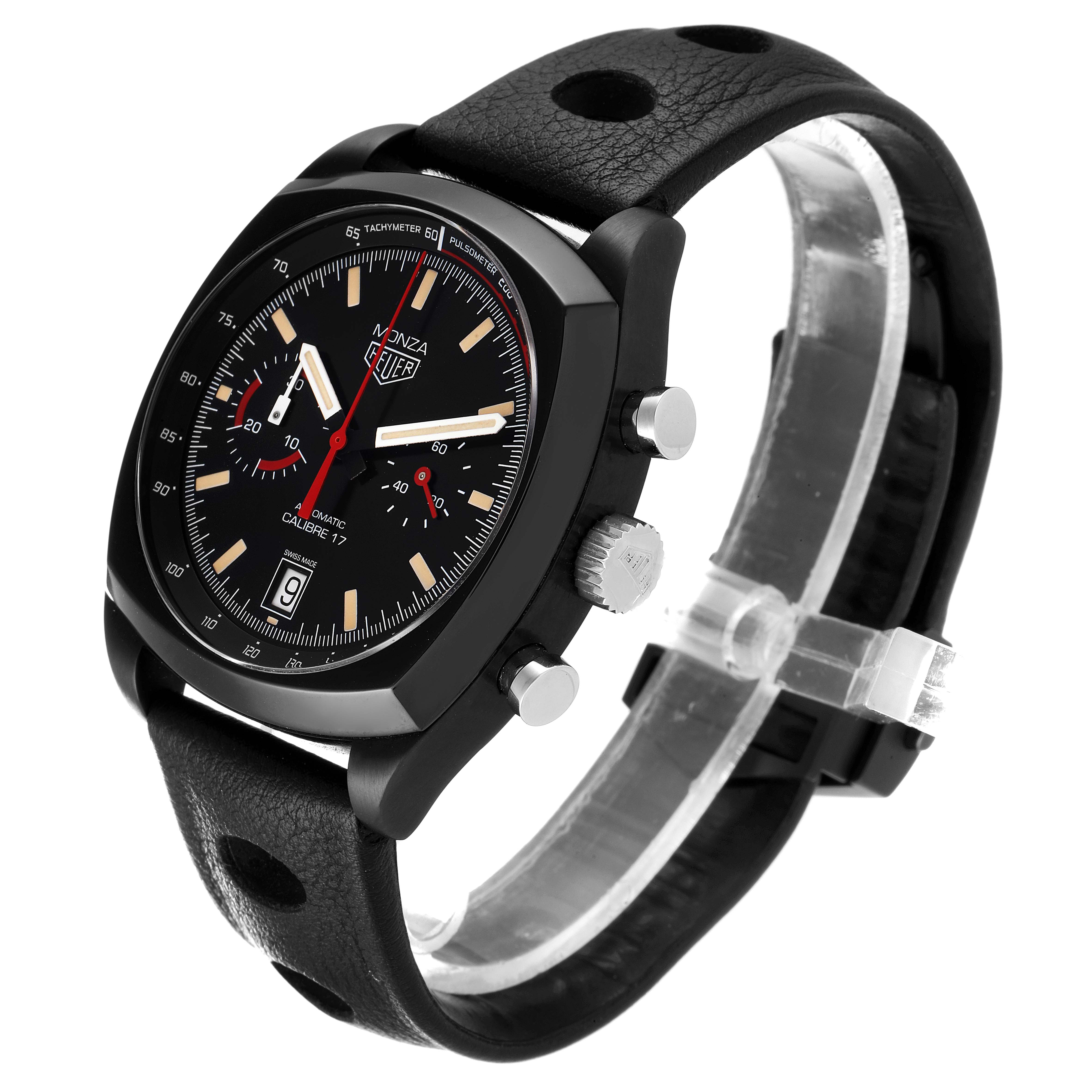 The image shows a Tag Heuer Monza watch at a front-side angle, featuring its black dial, chronograph subdials, and black leather strap.