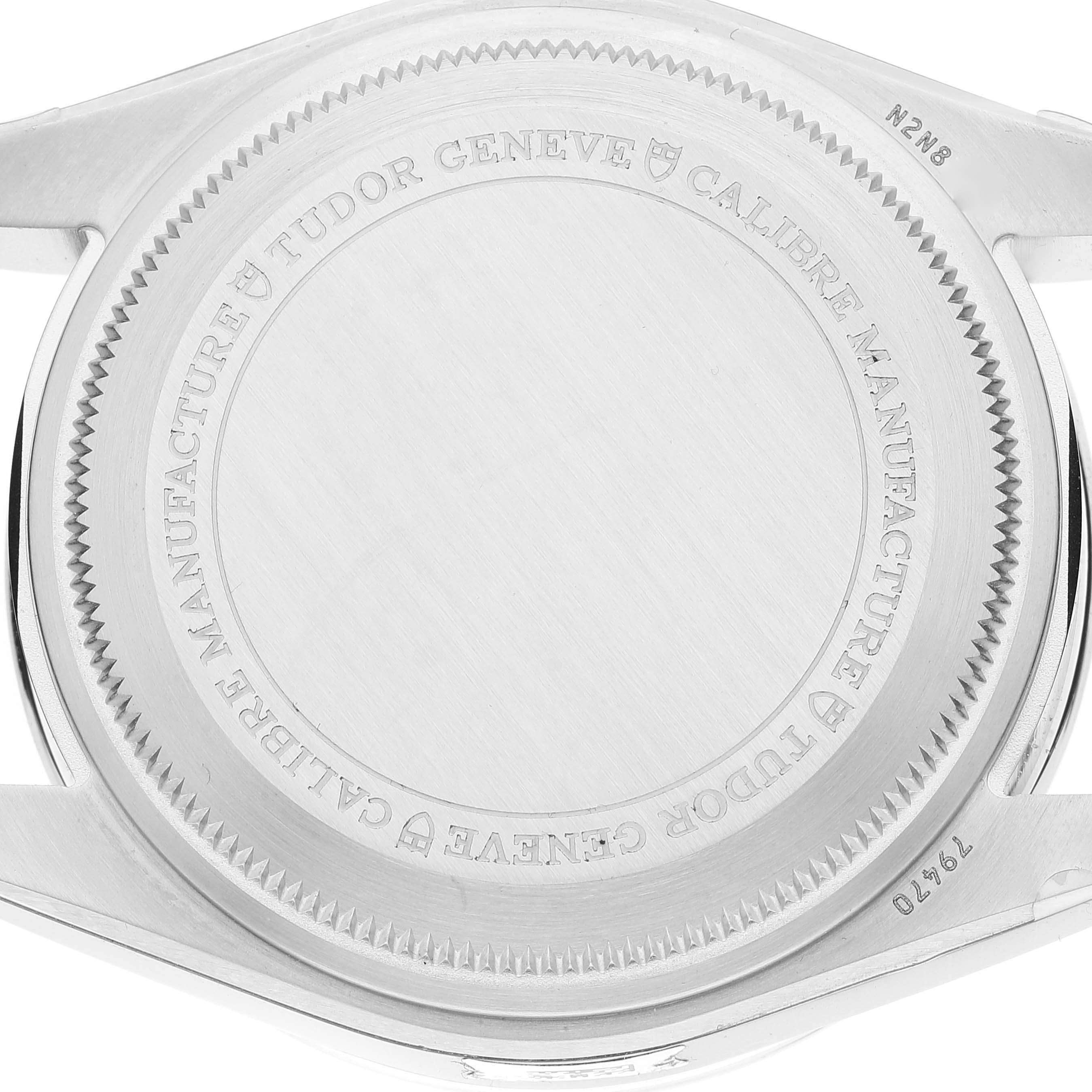 The image shows the back case of a Tudor Heritage Black Bay M79470-0003 Men
s Stainless Steel Black Dial M79470-0003 Men
s Stainless Steel Black Dial watch, displaying the engraved details and rim.