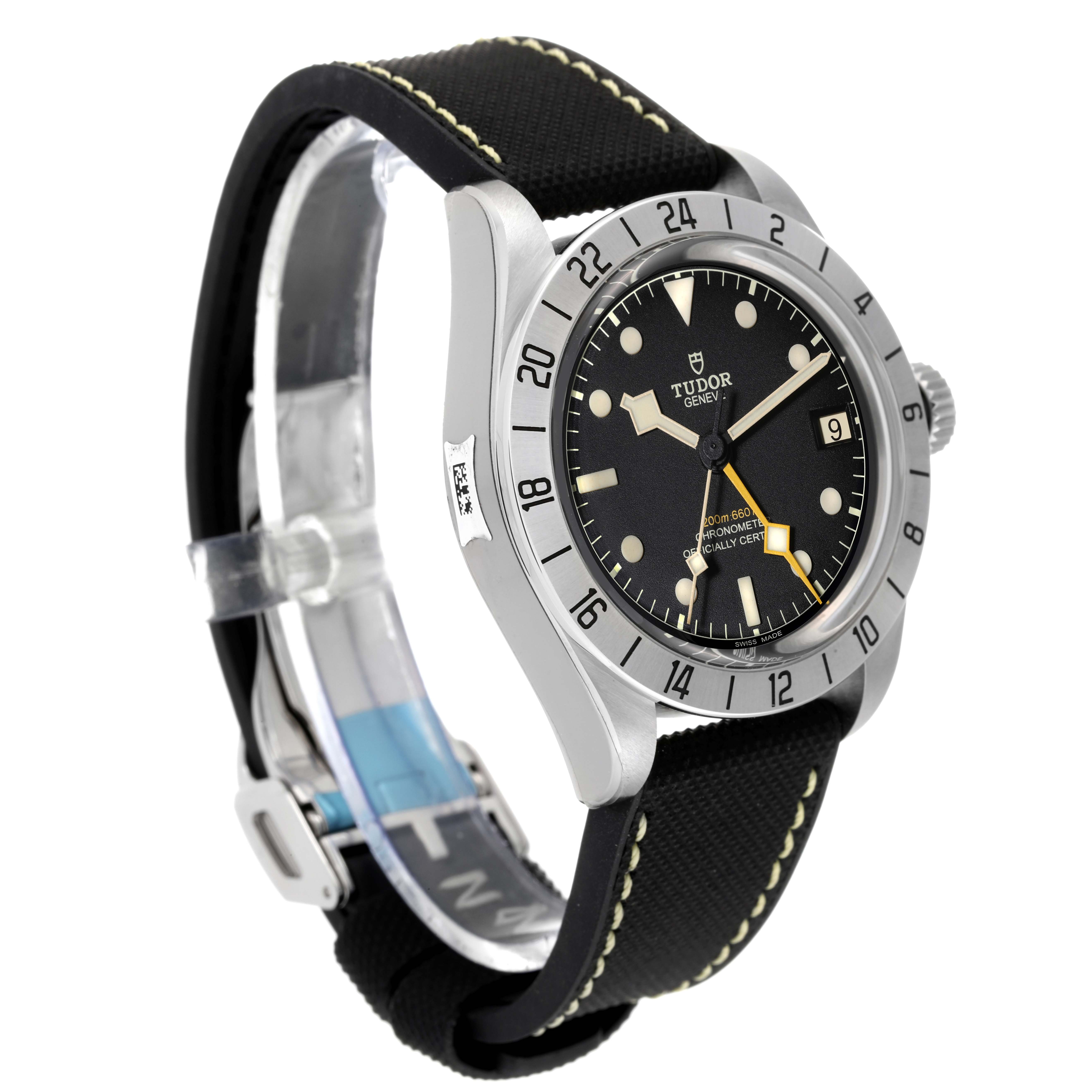 The Heritage Black Bay watch by Tudor is shown at a three-quarter angle, highlighting its face, bezel, case, and strap.