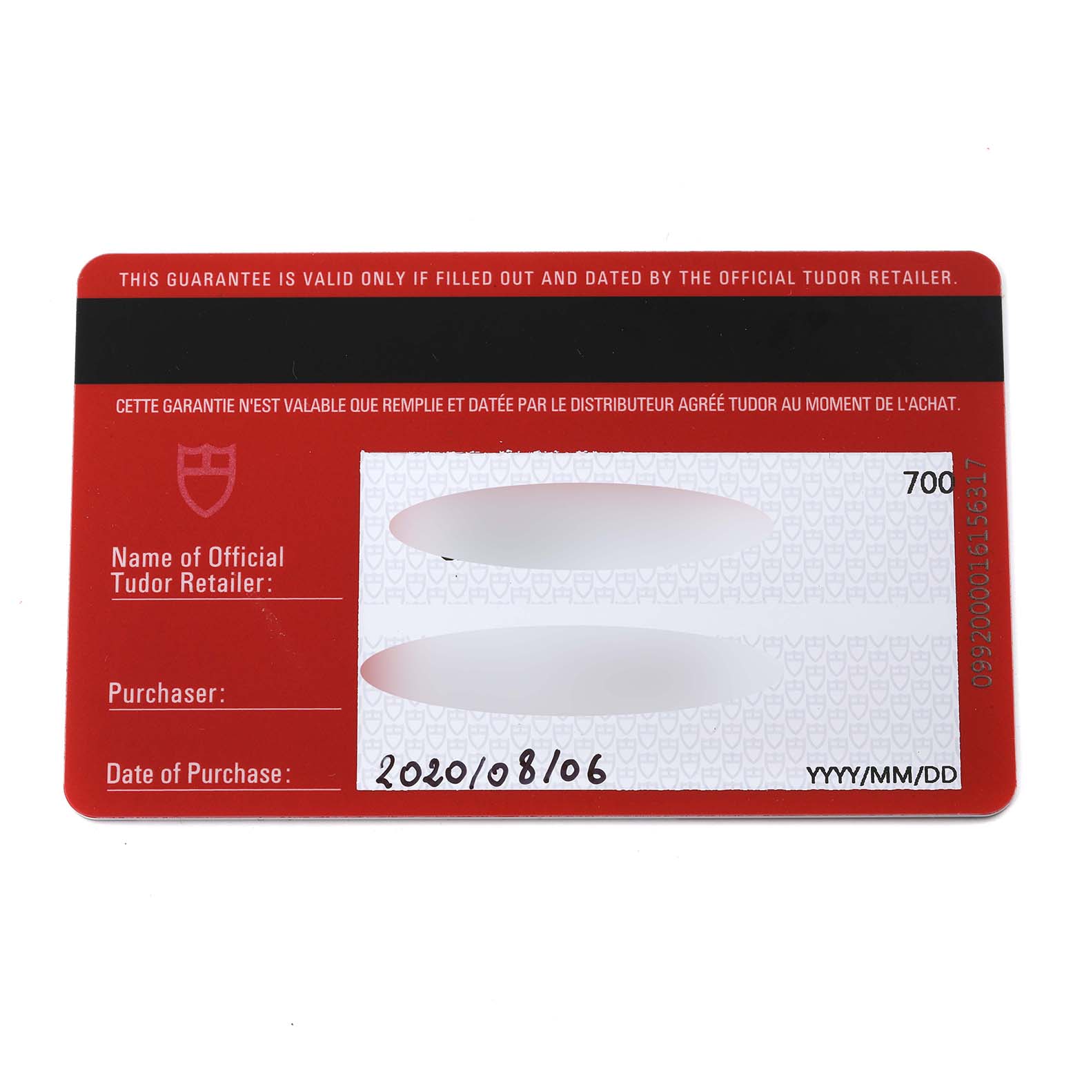 The image shows a Tudor warranty card for the Heritage Black Bay model, detailing the retailer and purchase date.