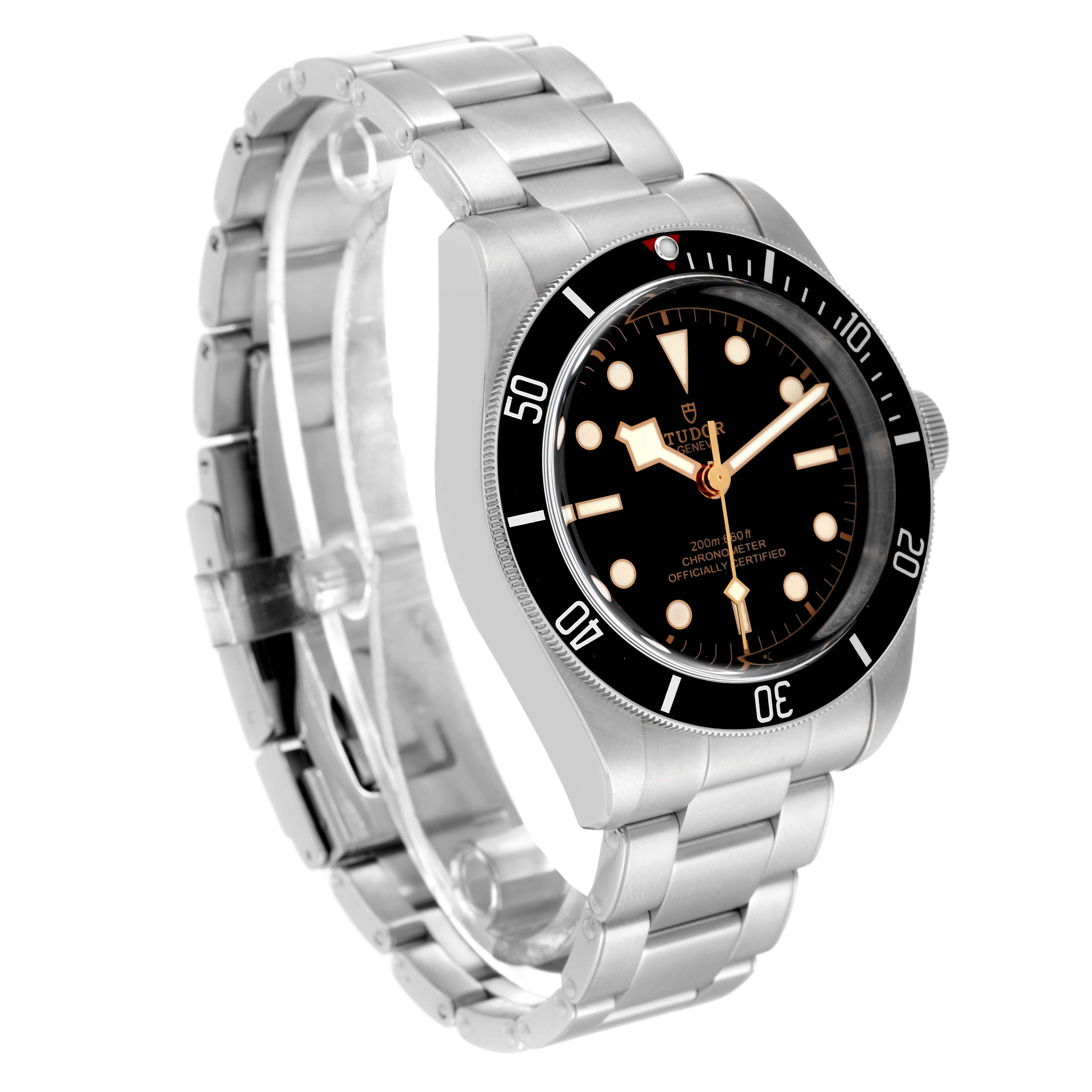 The Tudor Heritage Black Bay 79230 Men
s Stainless Steel Black Dial 79230 Men
s Stainless Steel Black Dial watch is shown at an angle highlighting the face, bezel, and stainless steel bracelet.