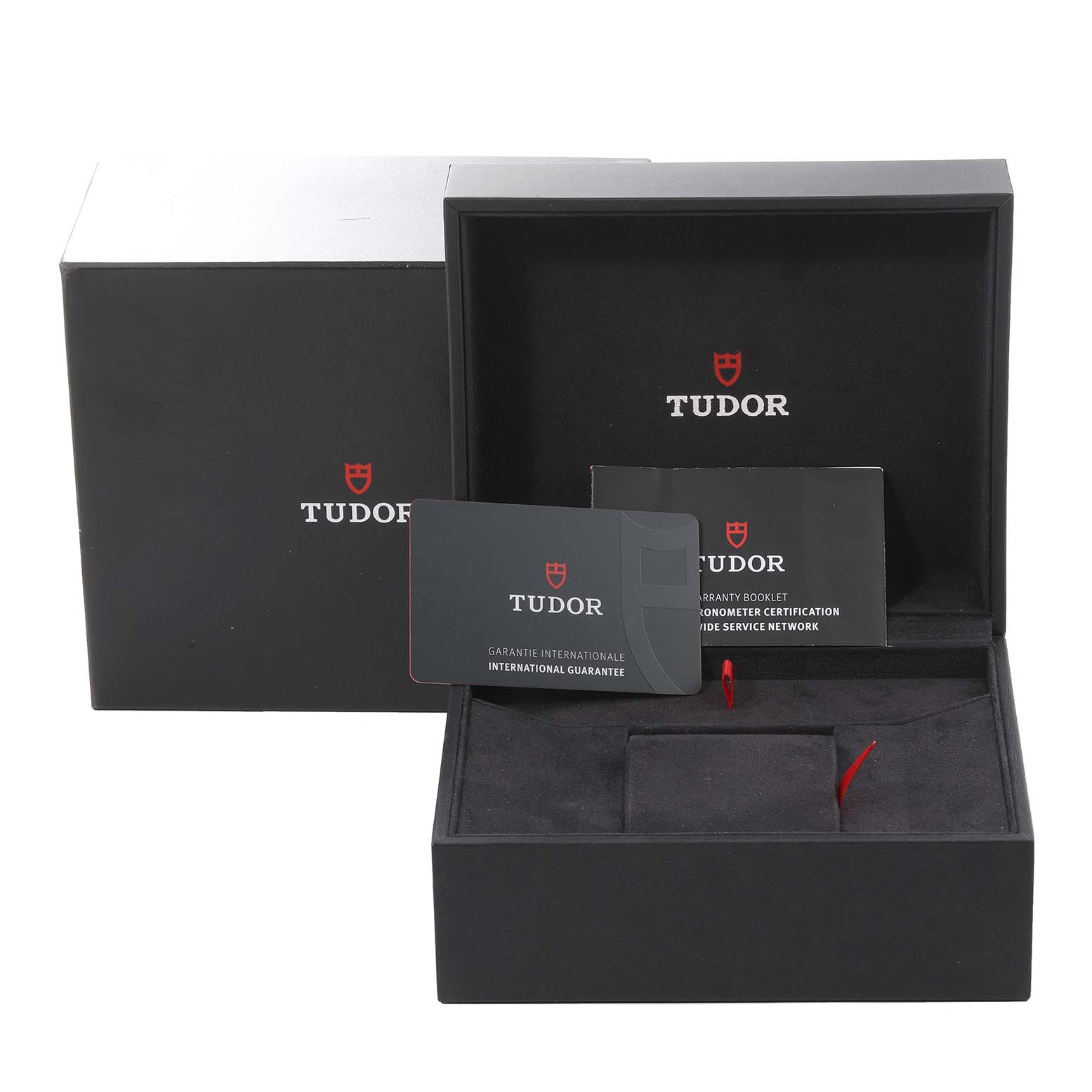 The image shows the Tudor Heritage Black Bay 79230 Men
s Stainless Steel Black Dial 79230 Men
s Stainless Steel Black Dial watch packaging, including the box, warranty card, and booklets.
