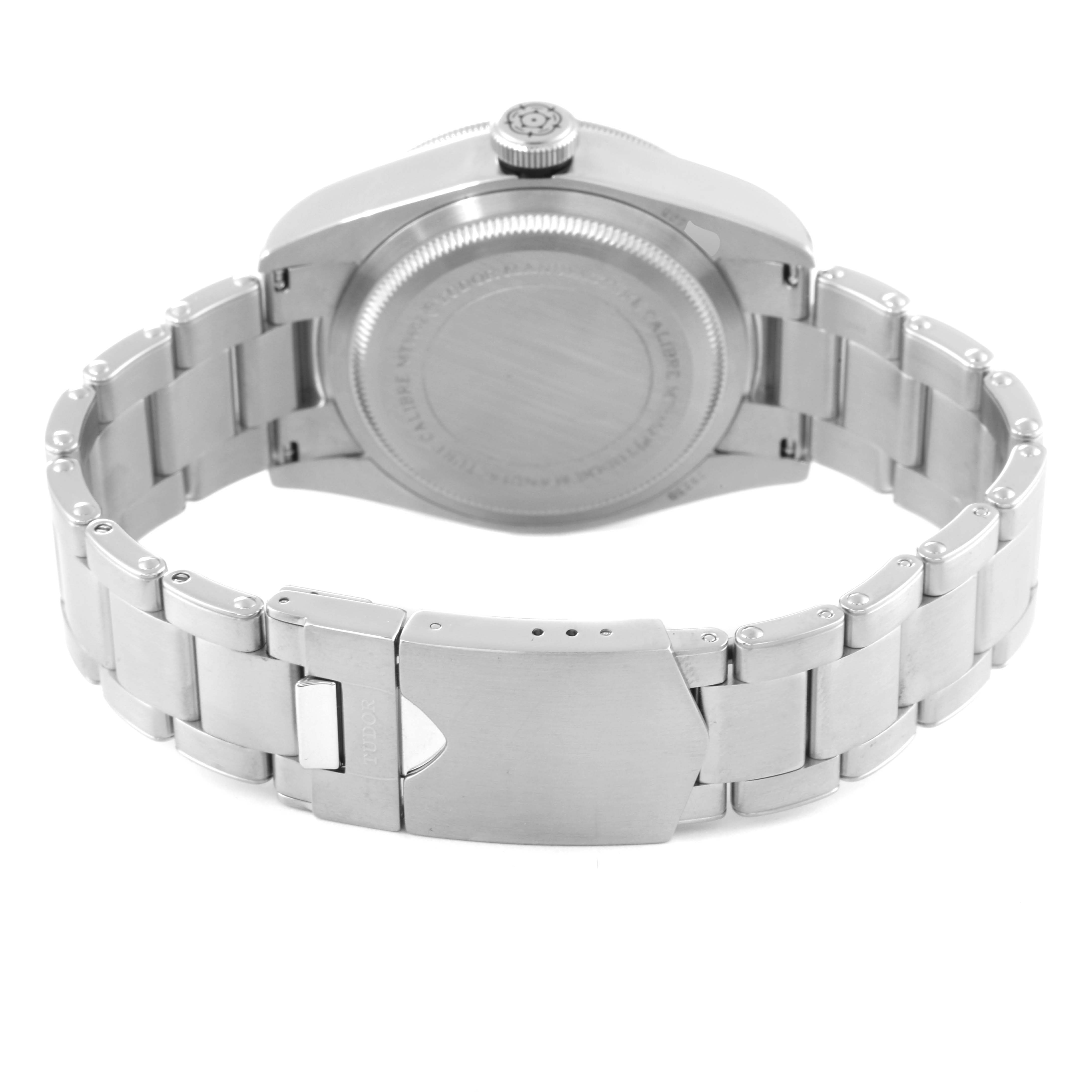 The image shows the back side of the Tudor Heritage Black Bay 79230 Men
s Stainless Steel Black Dial 79230 Men
s Stainless Steel Black Dial watch, highlighting the case back, crown, and bracelet with clasp.