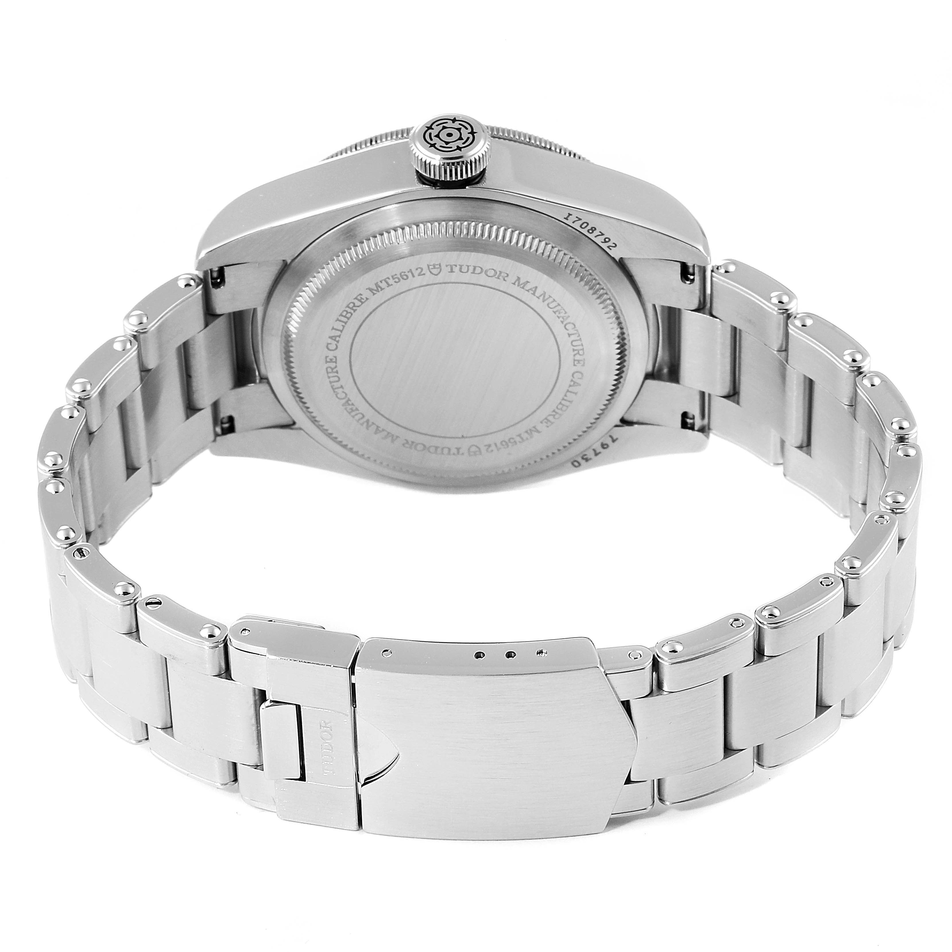 This image shows the back view of a Tudor Heritage Black Bay 55020 Men's Stainless Steel Black Dial 55020 Men's Stainless Steel Black Dial watch, focusing on the case back and metal bracelet.