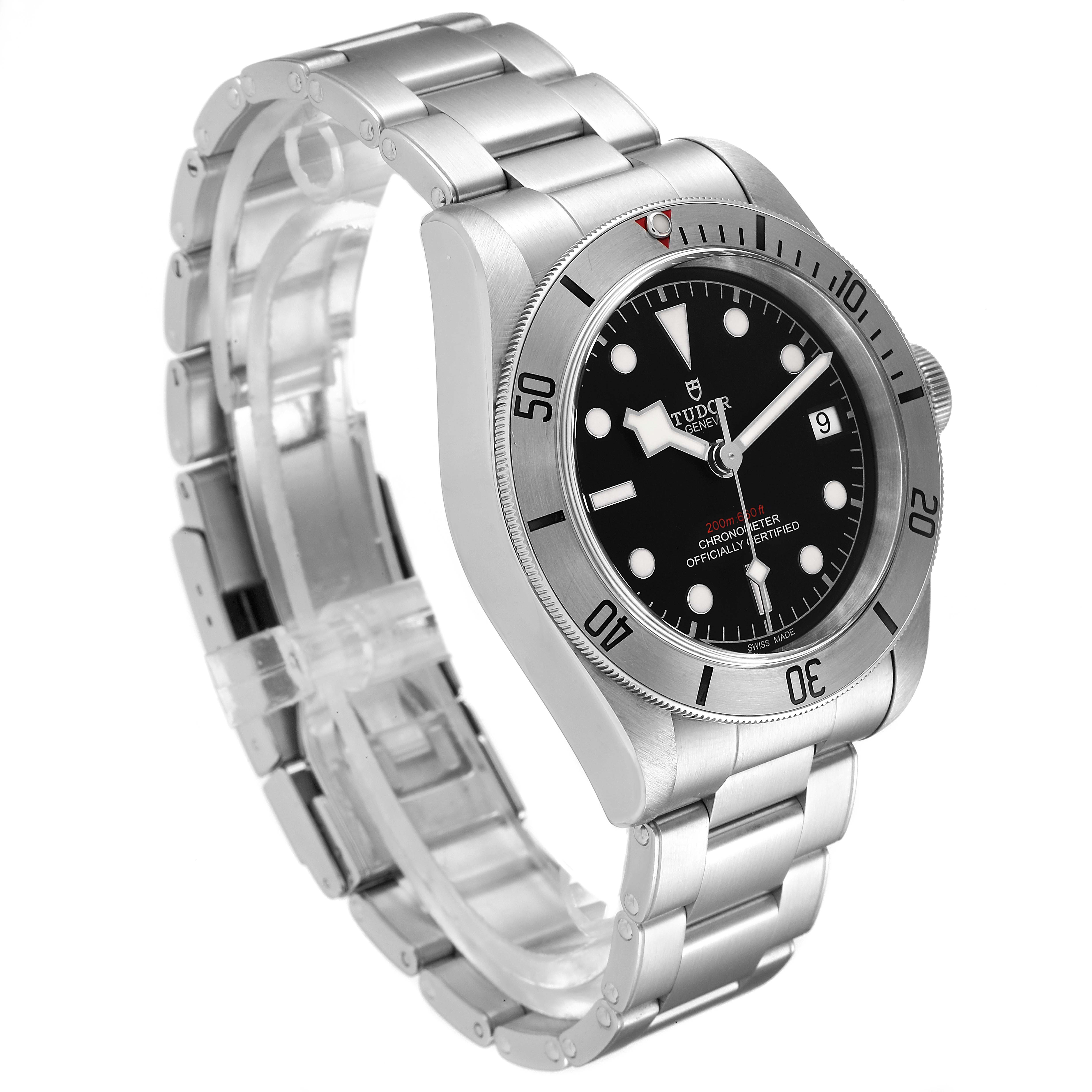 The Tudor Heritage Black Bay 55020 Men's Stainless Steel Black Dial 55020 Men's Stainless Steel Black Dial watch is photographed at an angle showcasing the dial, bezel, and metal bracelet.