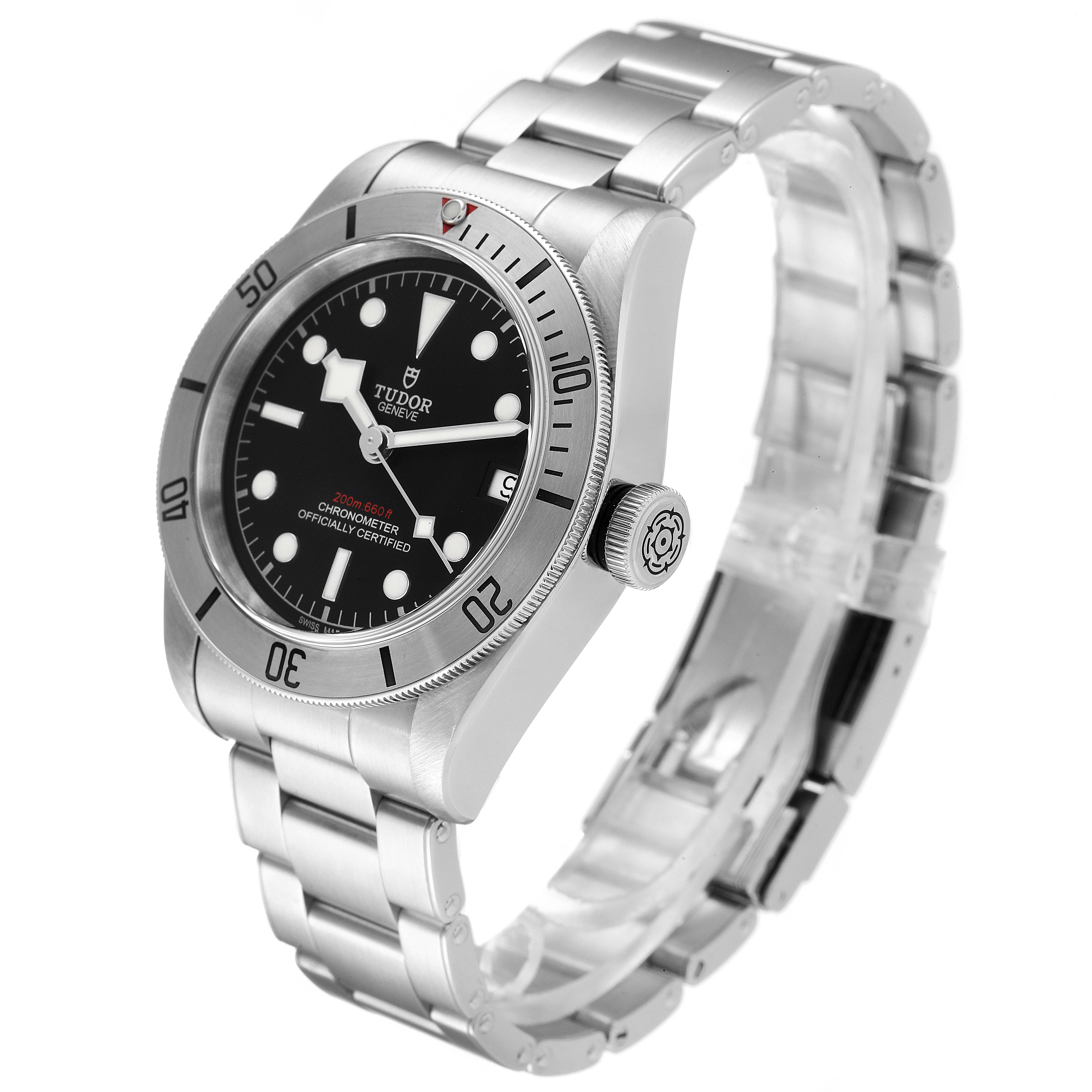 The image shows a side angle of the Tudor Heritage Black Bay 55020 Men's Stainless Steel Black Dial 55020 Men's Stainless Steel Black Dial watch, highlighting its dial, bezel, and stainless steel bracelet.