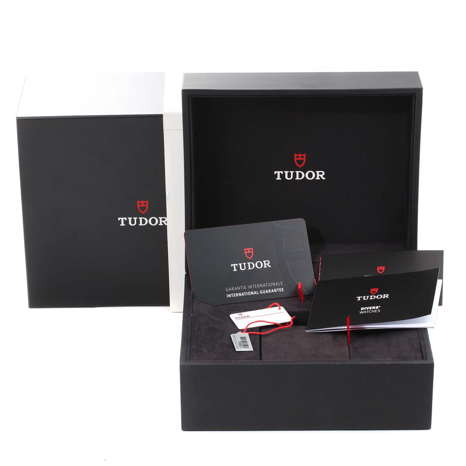 The image shows the packaging, warranty card, and manuals for the Tudor Heritage Black Bay 55020 Men's Stainless Steel Black Dial 55020 Men's Stainless Steel Black Dial watch from a frontal angle.