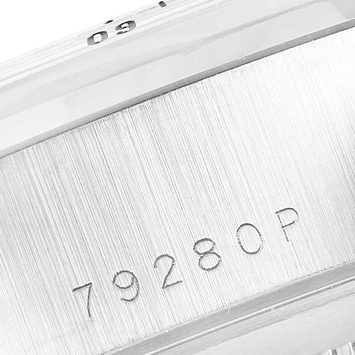 The image shows a close-up angle of the Tudor Prince 79280 Men
s Stainless Steel Silver Dial 79280 Men
s Stainless Steel Silver Dial model watch bezel, revealing the model number "79280P" engraved on it.
