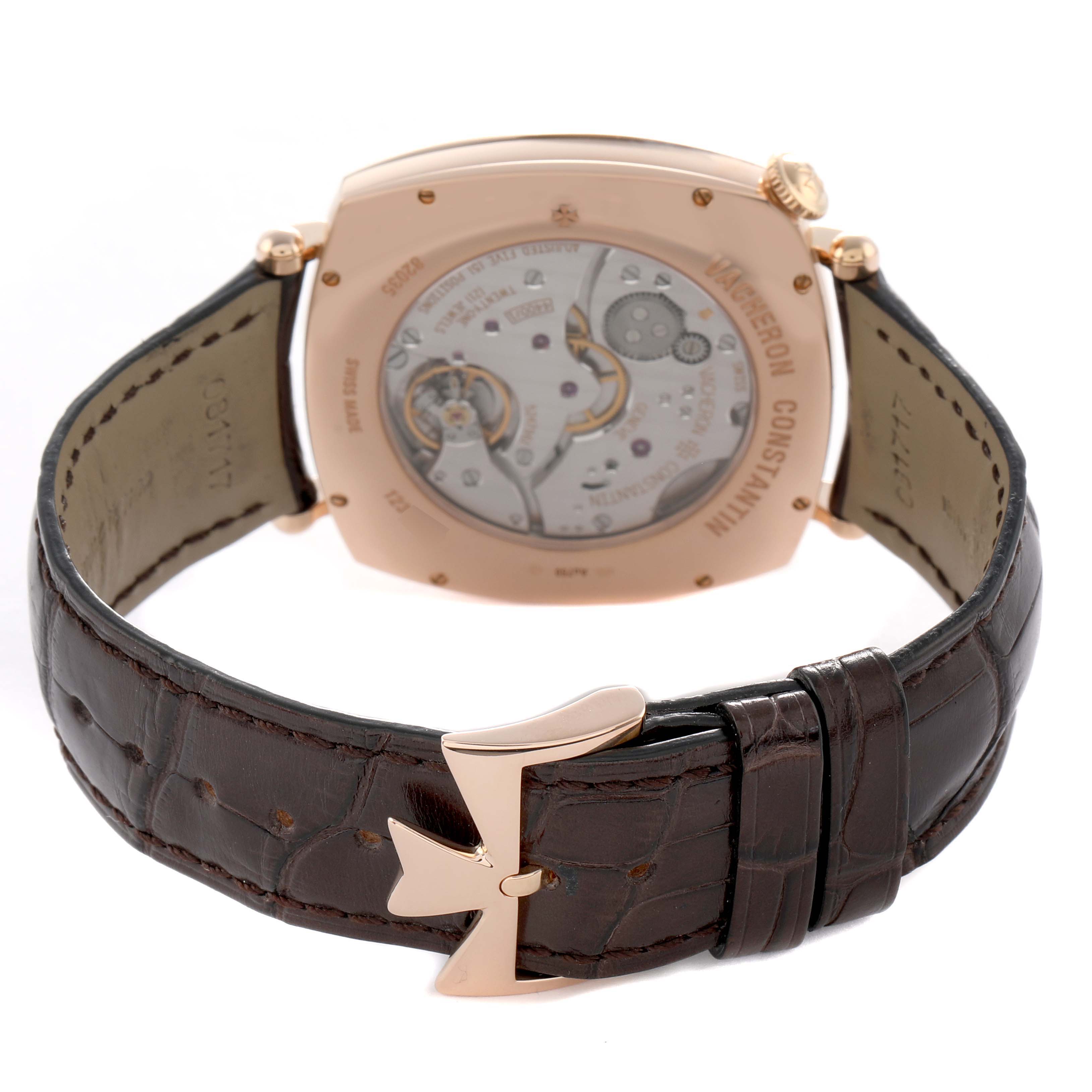 The image shows the back view of a Vacheron Constantin Historiques 82035/000R-9359 Men's Rose Gold Silver Dial watch, highlighting the case back and movement with a brown leather strap.