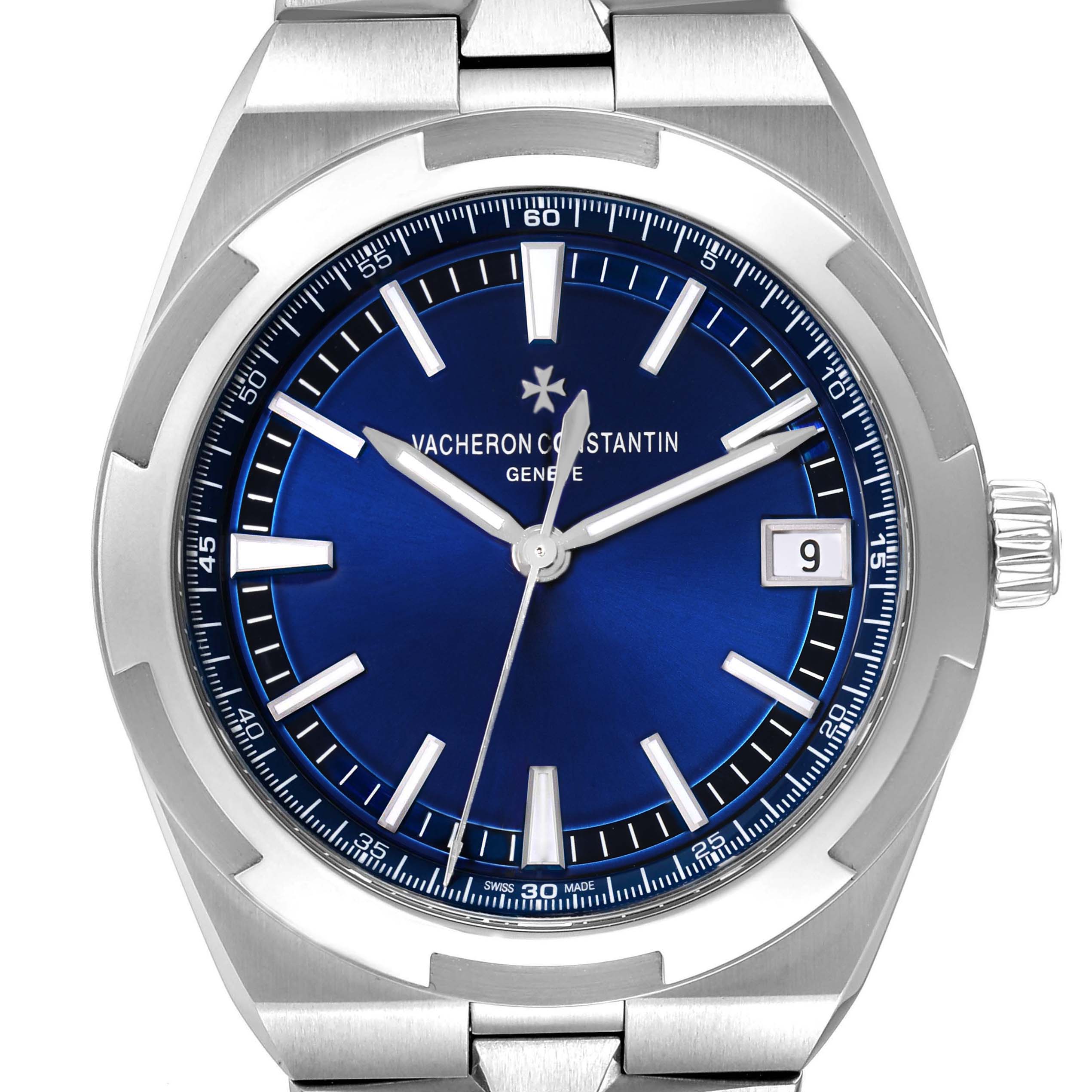 The Vacheron Constantin Overseas 4500V Men's Stainless Steel Blue Dial watch is shown from a frontal angle, highlighting its blue dial, hands, crown, and part of the stainless steel bracelet.