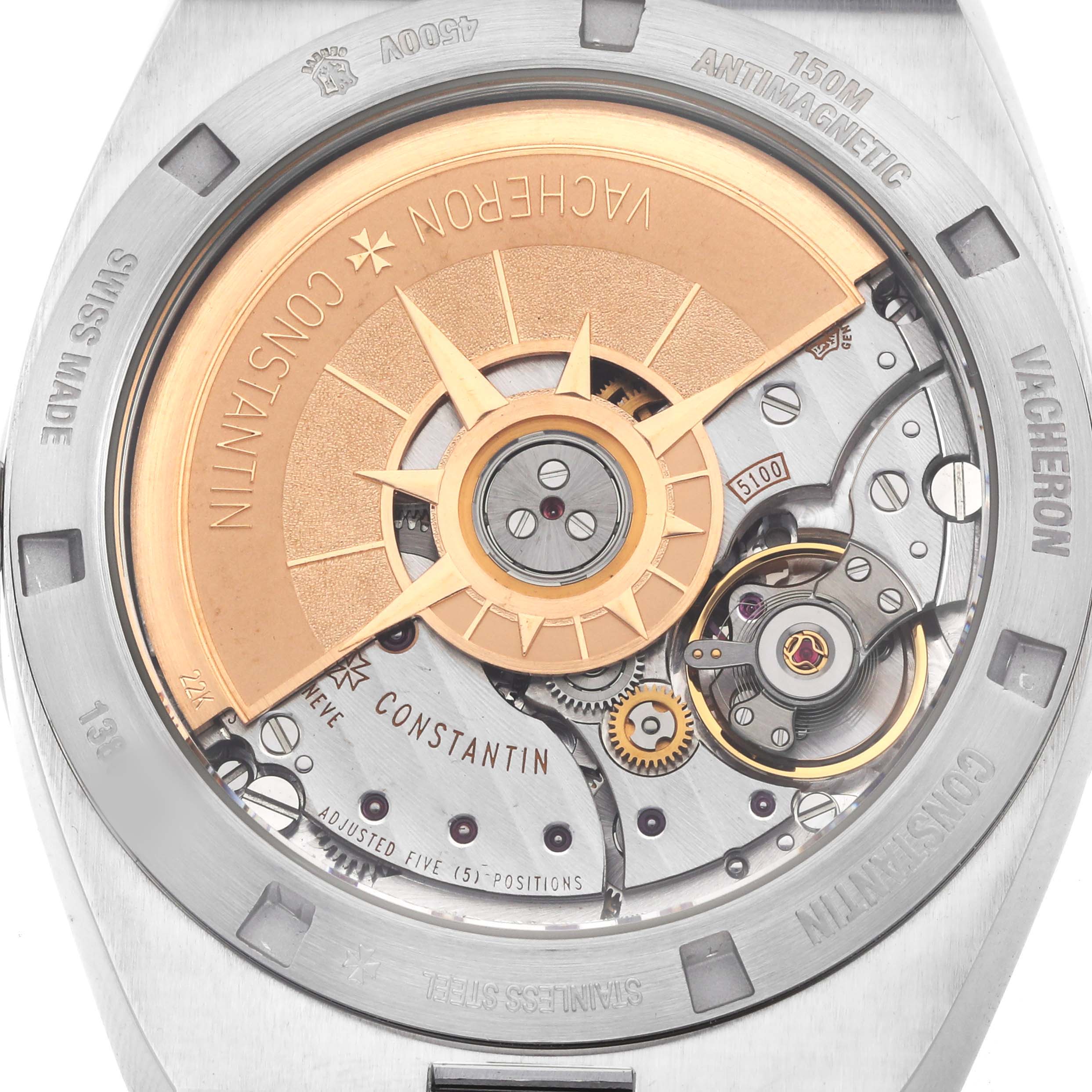 The image shows a close-up of the Vacheron Constantin Overseas 4500V Men's Stainless Steel Blue Dial watch's movement from the back, highlighting the rotor and intricate mechanics.