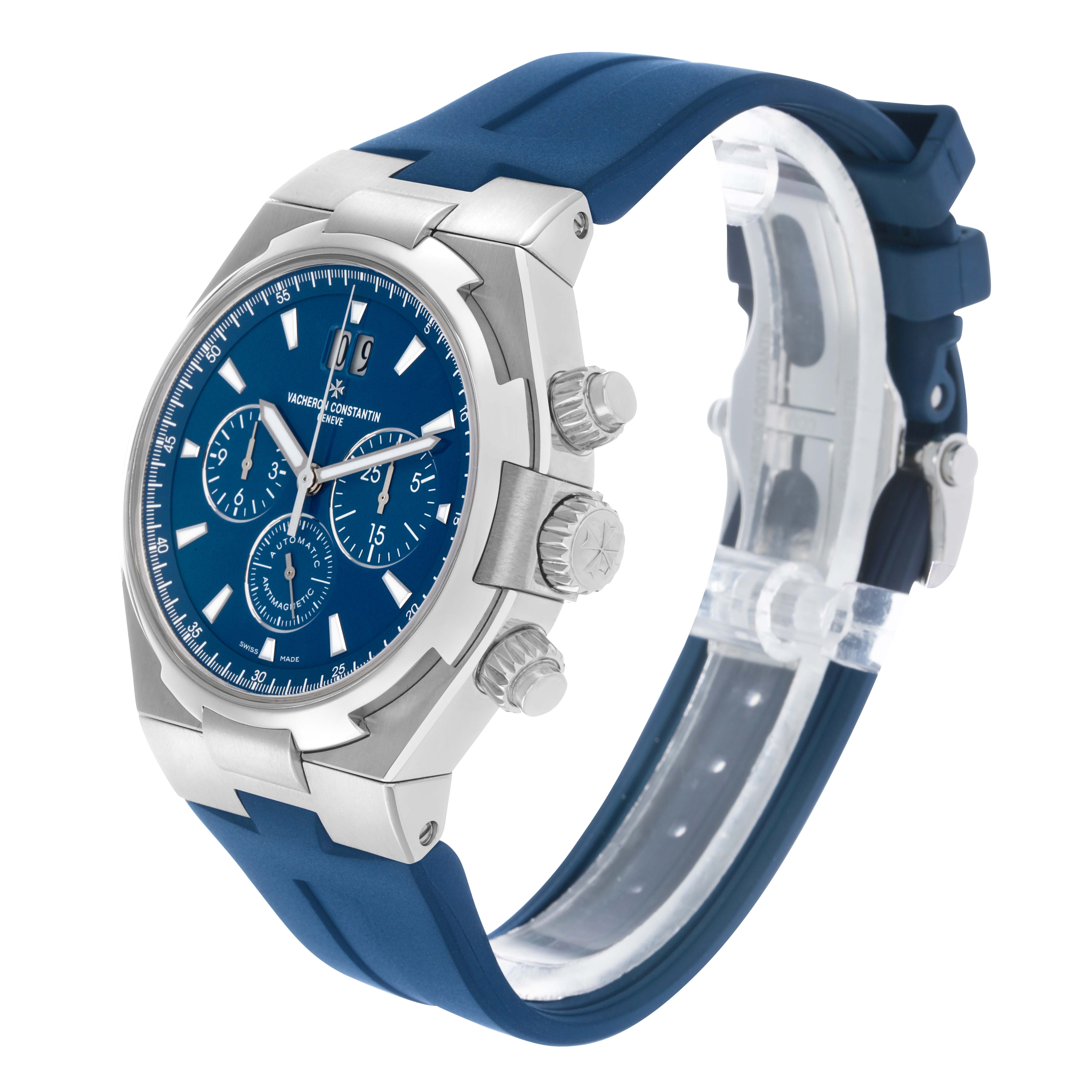 The Vacheron Constantin Overseas 49150 Men's Stainless Steel Blue Dial watch is shown at a three-quarter angle, displaying the face, crown, chronograph pushers, and blue strap.