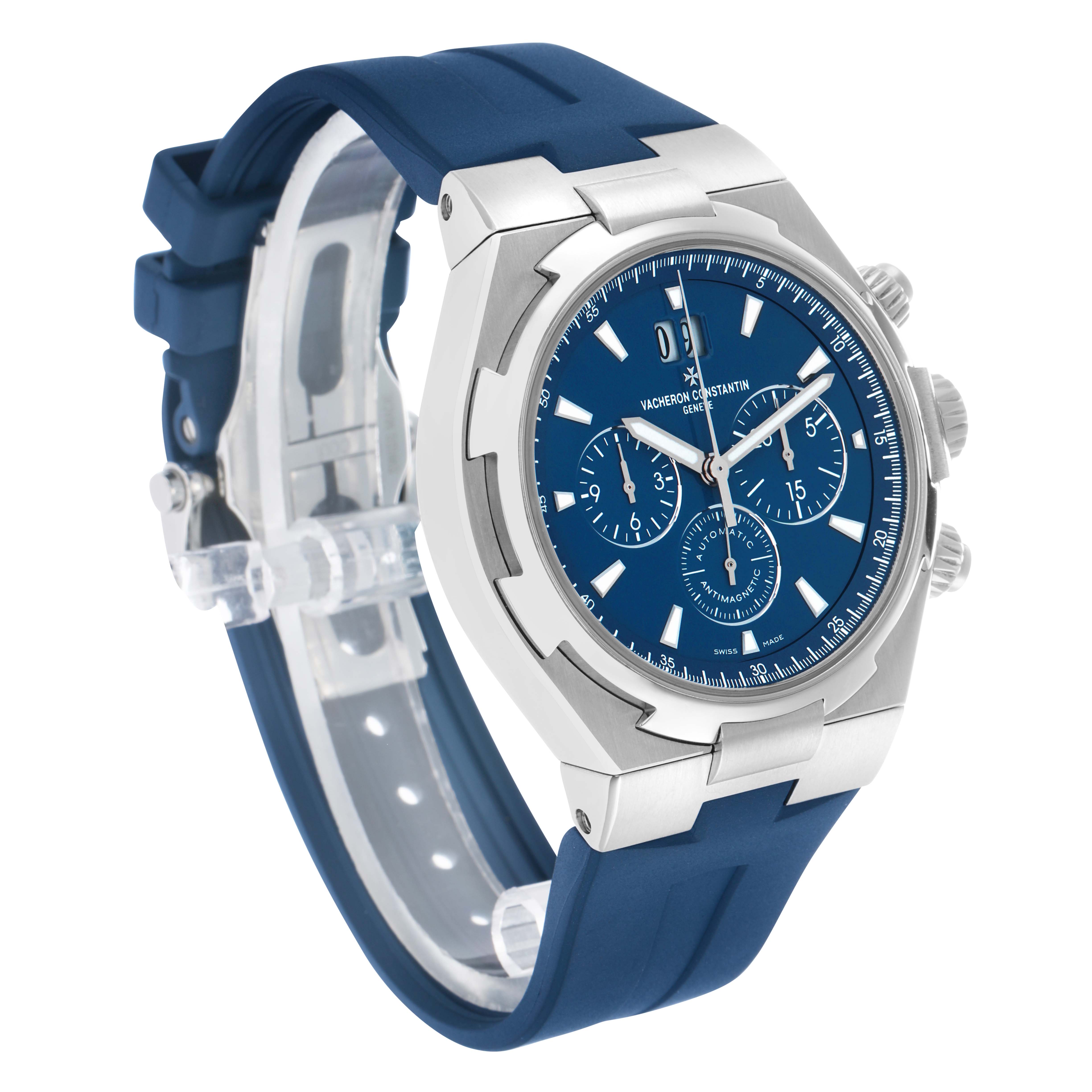 The Vacheron Constantin Overseas 49150 Men's Stainless Steel Blue Dial watch is shown at a three-quarter angle, displaying the dial, case, and blue strap.