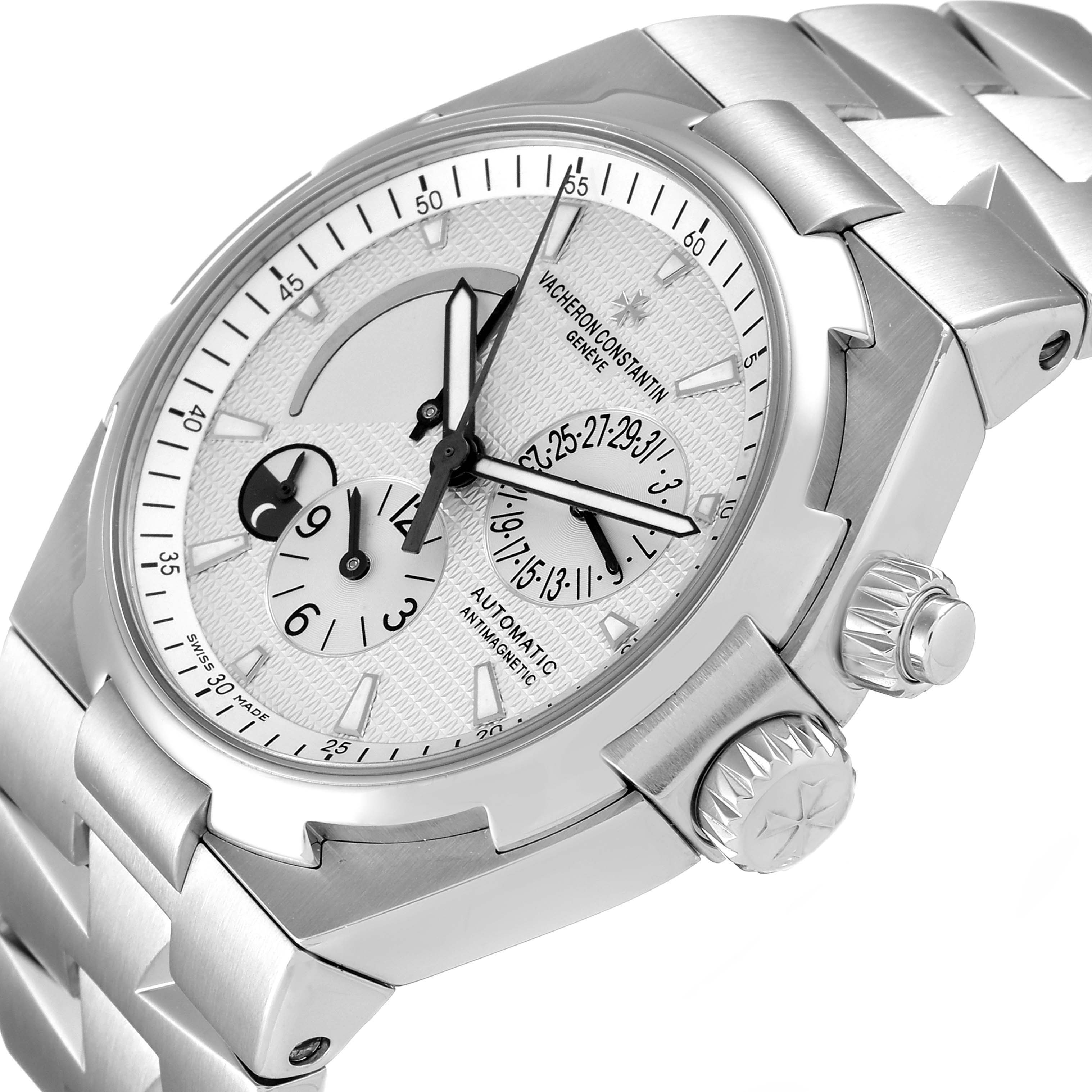 This image shows a Vacheron Constantin Overseas 47450/B01A-9226 Men
s Stainless Steel Silver Dial 47450/B01A-9226 Men
s Stainless Steel Silver Dial model watch from a top-side angle, highlighting the face, bezel, and crown.