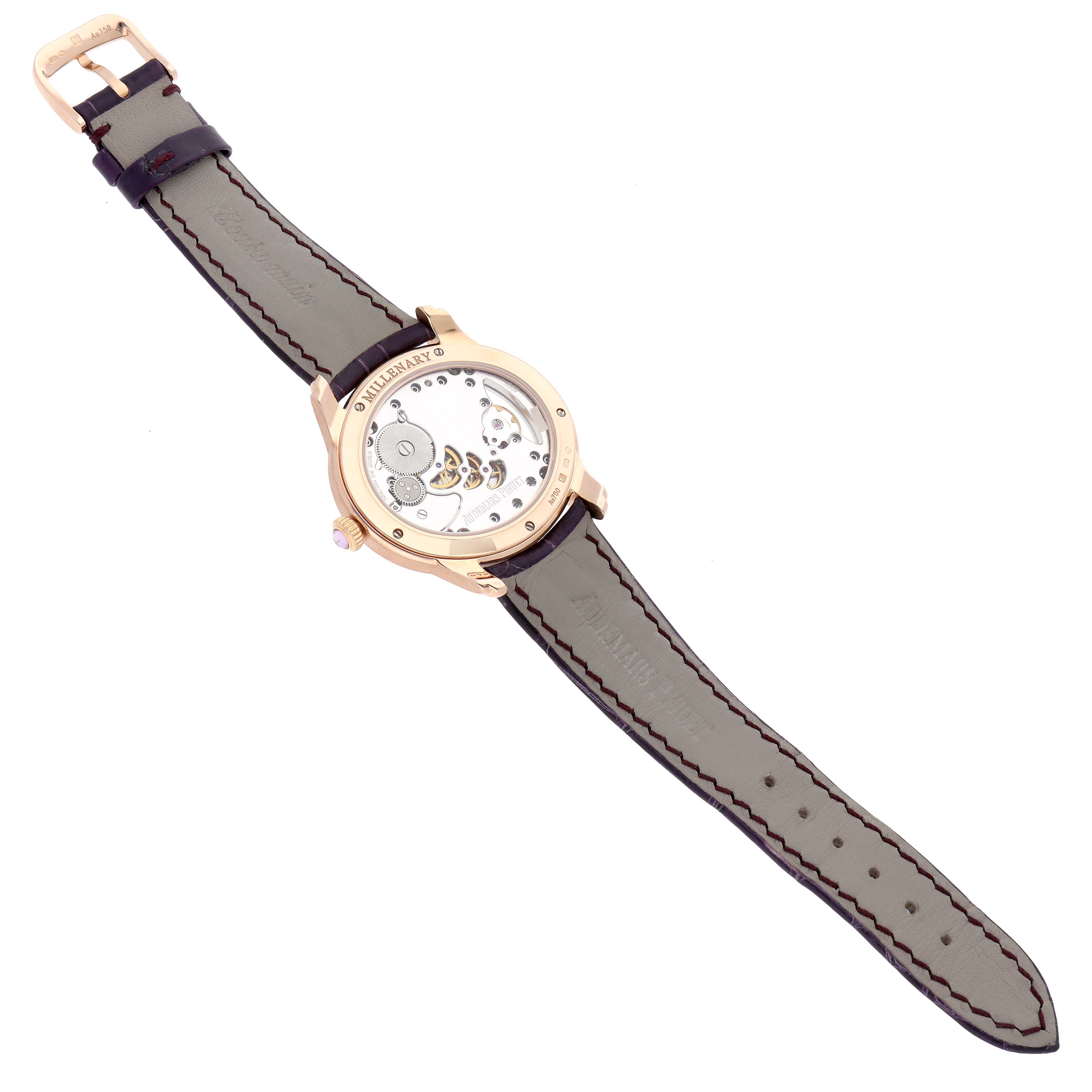 The Audemars Piguet Millenary 77247OR Women's Rose Gold Mother of Pearl Dial watch is shown from the back, displaying its transparent case back and mechanical movement.