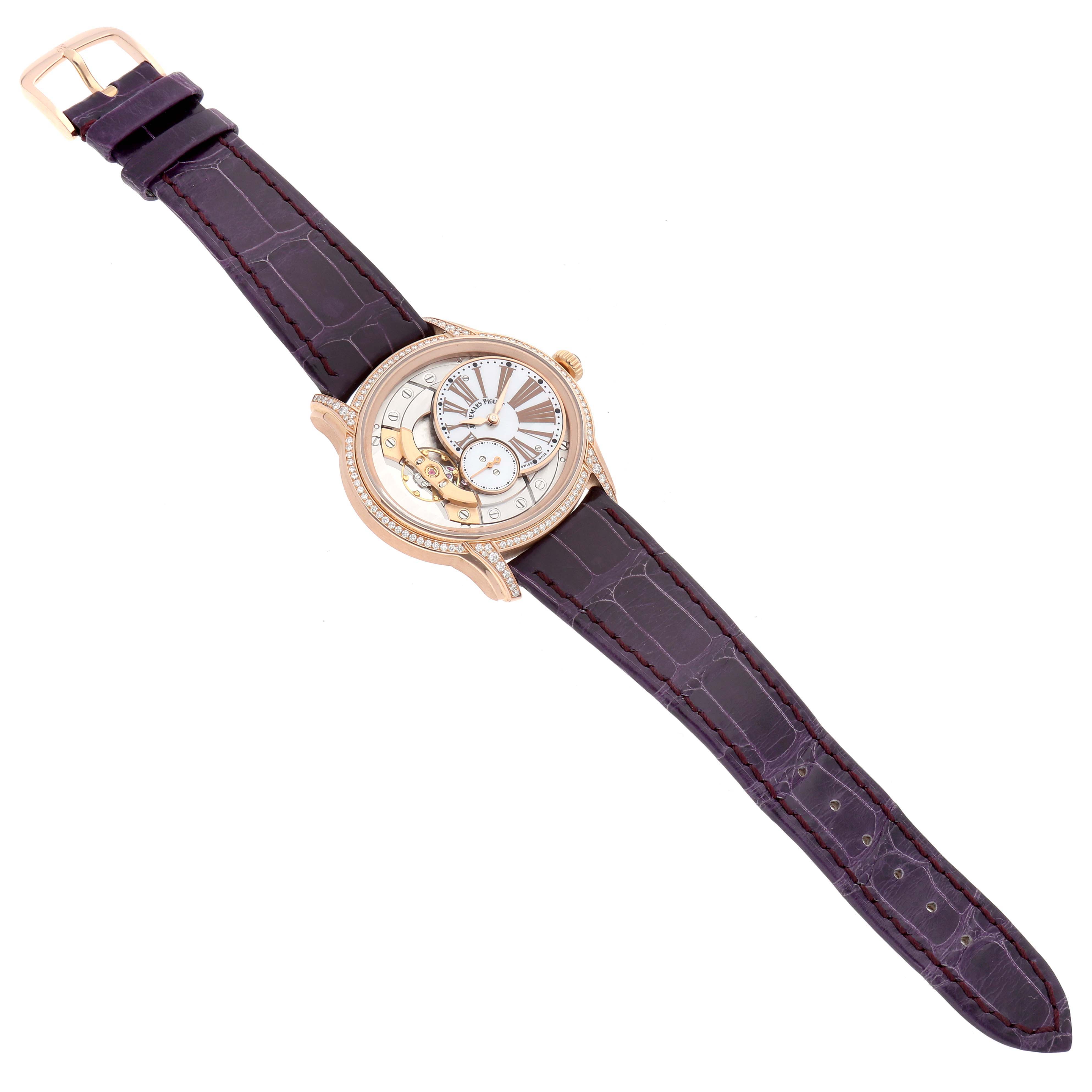 The Audemars Piguet Millenary 77247OR Women's Rose Gold Mother of Pearl Dial watch is shown from an overhead angle, displaying its detailed face and full leather strap.