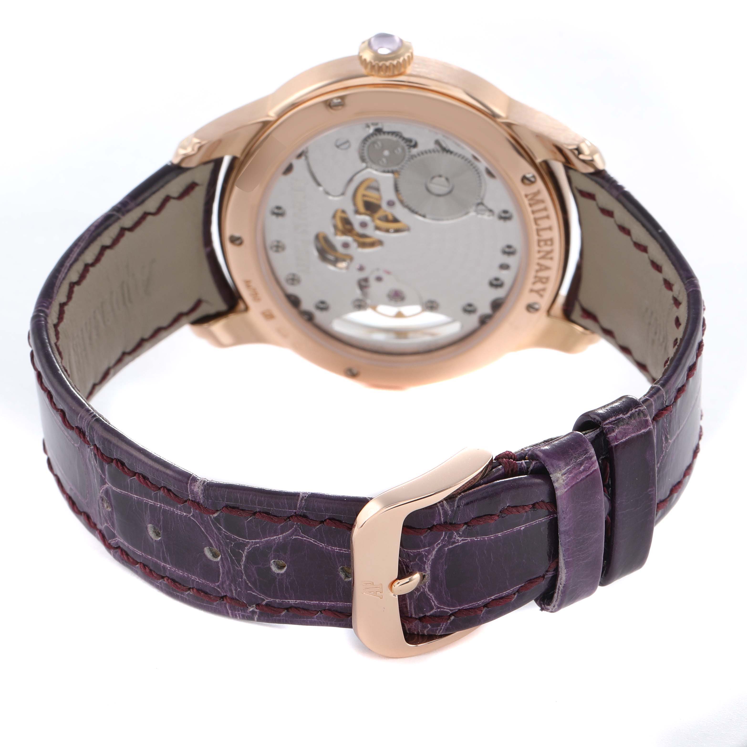The image shows the back of the Audemars Piguet Millenary 77247OR Women's Rose Gold Mother of Pearl Dial watch, highlighting its movement and leather strap with buckle.