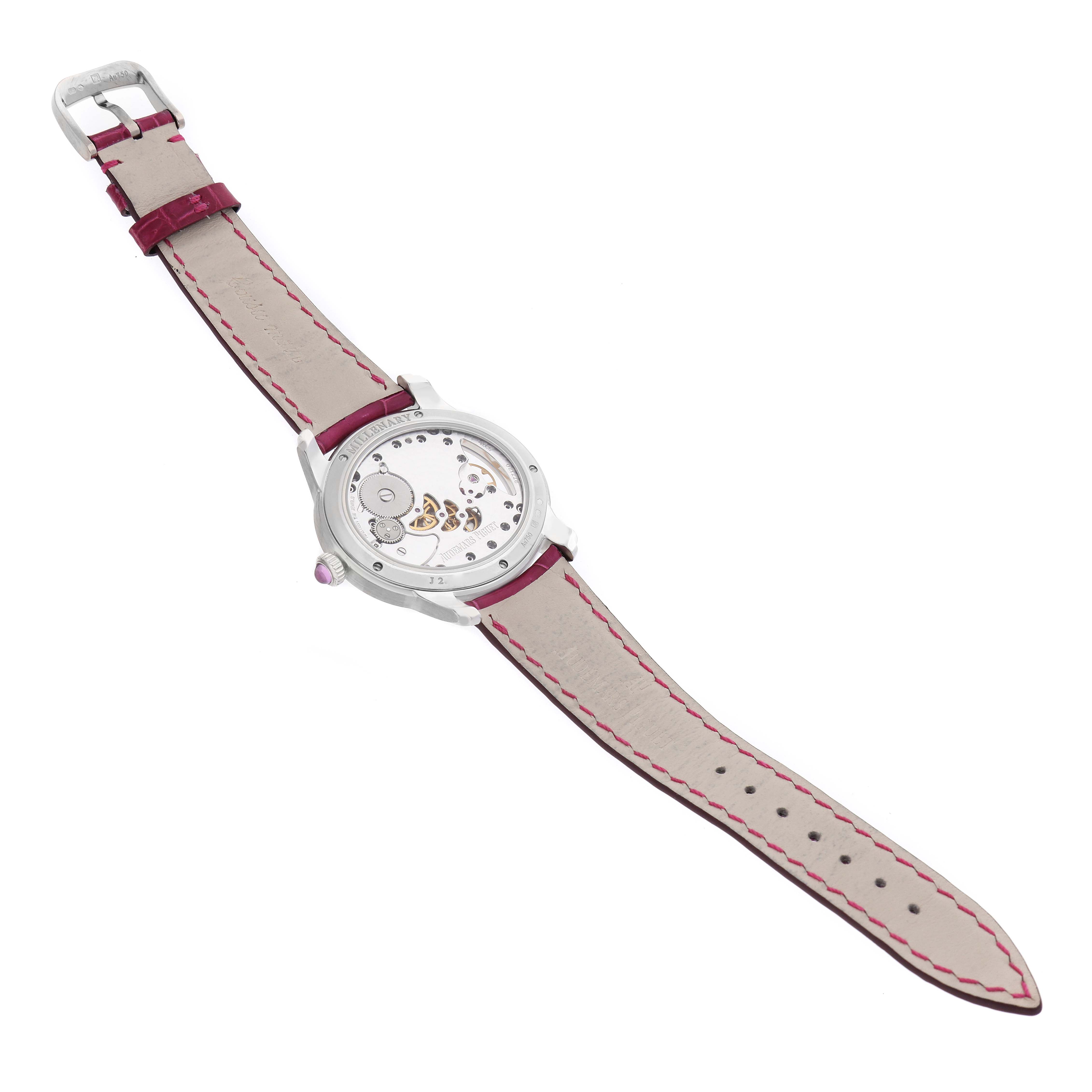 The image shows the back view of the Audemars Piguet Millenary 77247BC Women's White Gold Mother of Pearl Dial watch, highlighting its movement and leather strap.