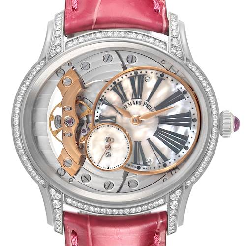 The Audemars Piguet Millenary 77247BC Women's White Gold Mother of Pearl Dial watch is shown from the front, featuring its dial, crown, and gem-set bezel with a pink strap.