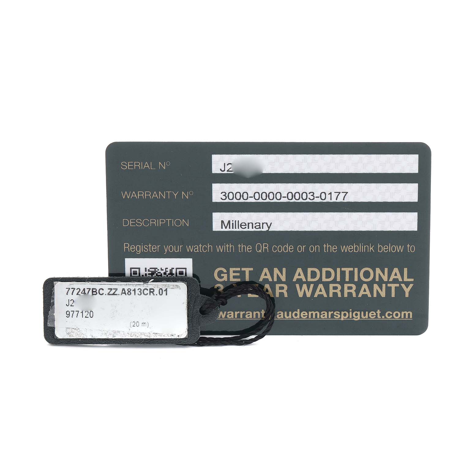The image shows a warranty card and a tag for the Audemars Piguet Millenary 77247BC Women's White Gold Mother of Pearl Dial watch, viewed from above.