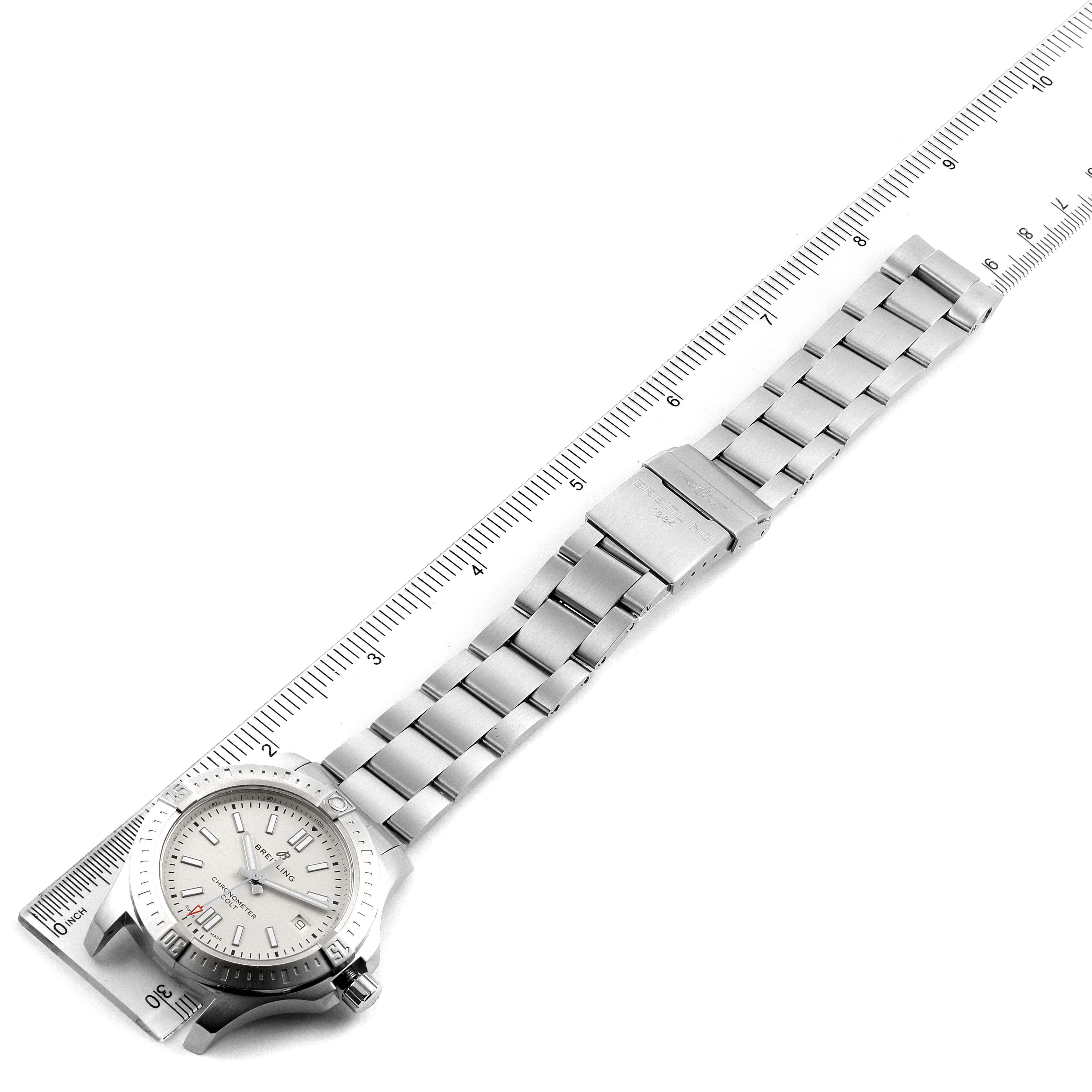 The Breitling Colt A17313 Men's Stainless Steel White Dial A17313 Men's Stainless Steel White Dial watch is shown flat with its entire stainless steel band and clasp visible, alongside a ruler for measuring.