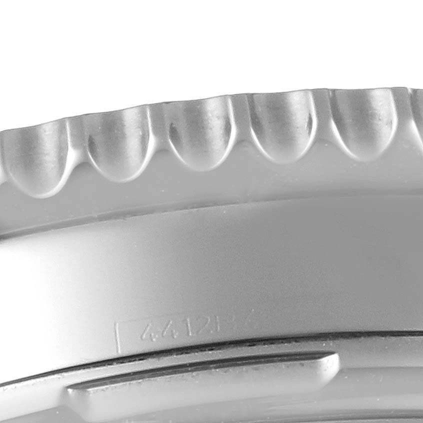 The image shows a close-up of the bezel and part of the case of a Breitling Navitimer AB0120 Men's Stainless Steel Black Dial AB0120 Men's Stainless Steel Black Dial watch at an angle.