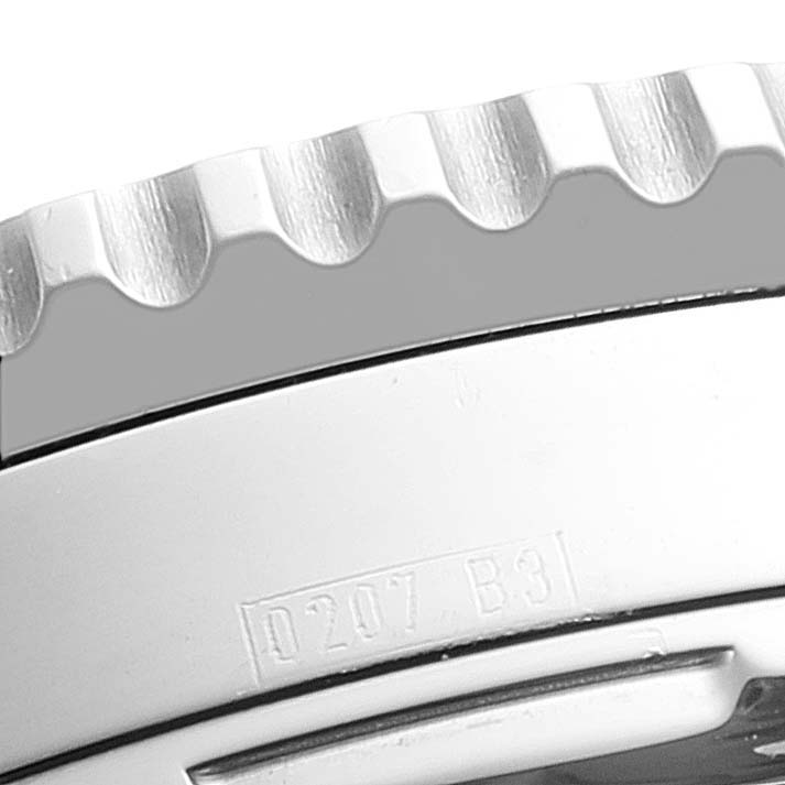 Close-up of the Breitling Navitimer A23322 Men
s Stainless Steel Black Dial A23322 Men
s Stainless Steel Black Dial watch bezel and case, showing engravings and part of the crown guard.