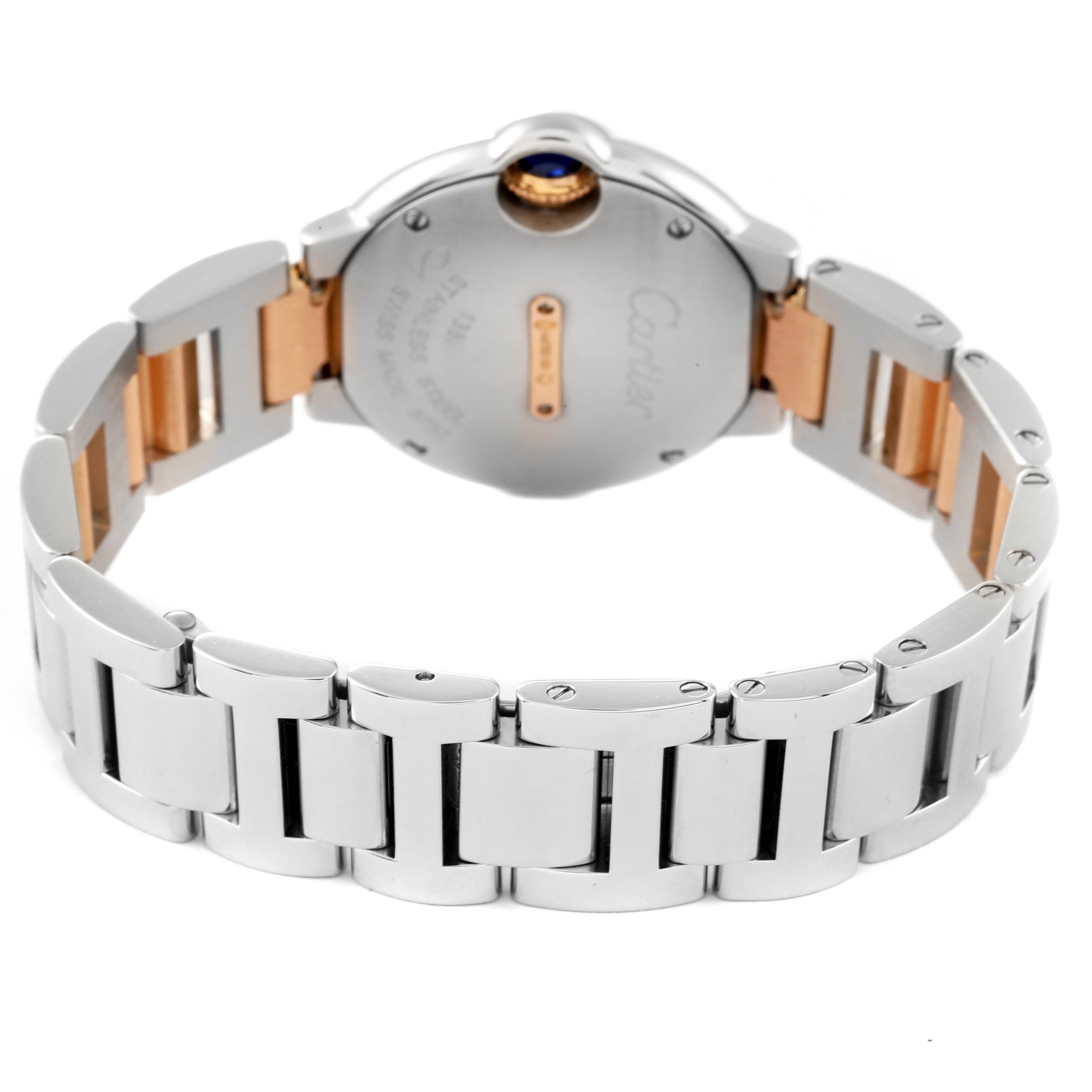 The image shows the back and bracelet of the Ballon Bleu watch by Cartier, highlighting its metal links and clasp.