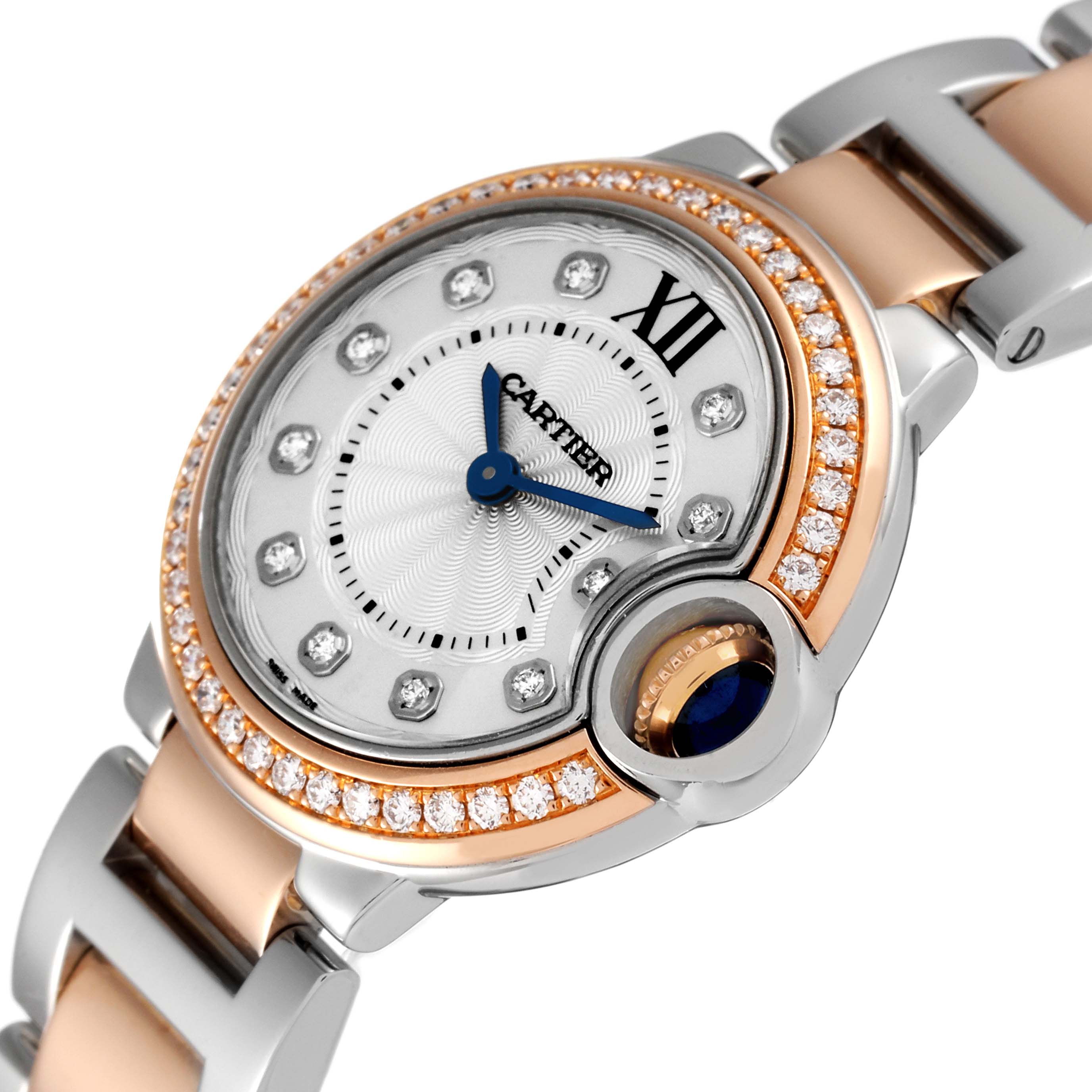 The image shows a close-up angle of the Cartier Ballon Bleu W3BB0009 Women's Steel and Gold (two tone) Silver Dial W3BB0009 Women's Steel and Gold (two tone) Silver Dial watch face and partially its bracelet.