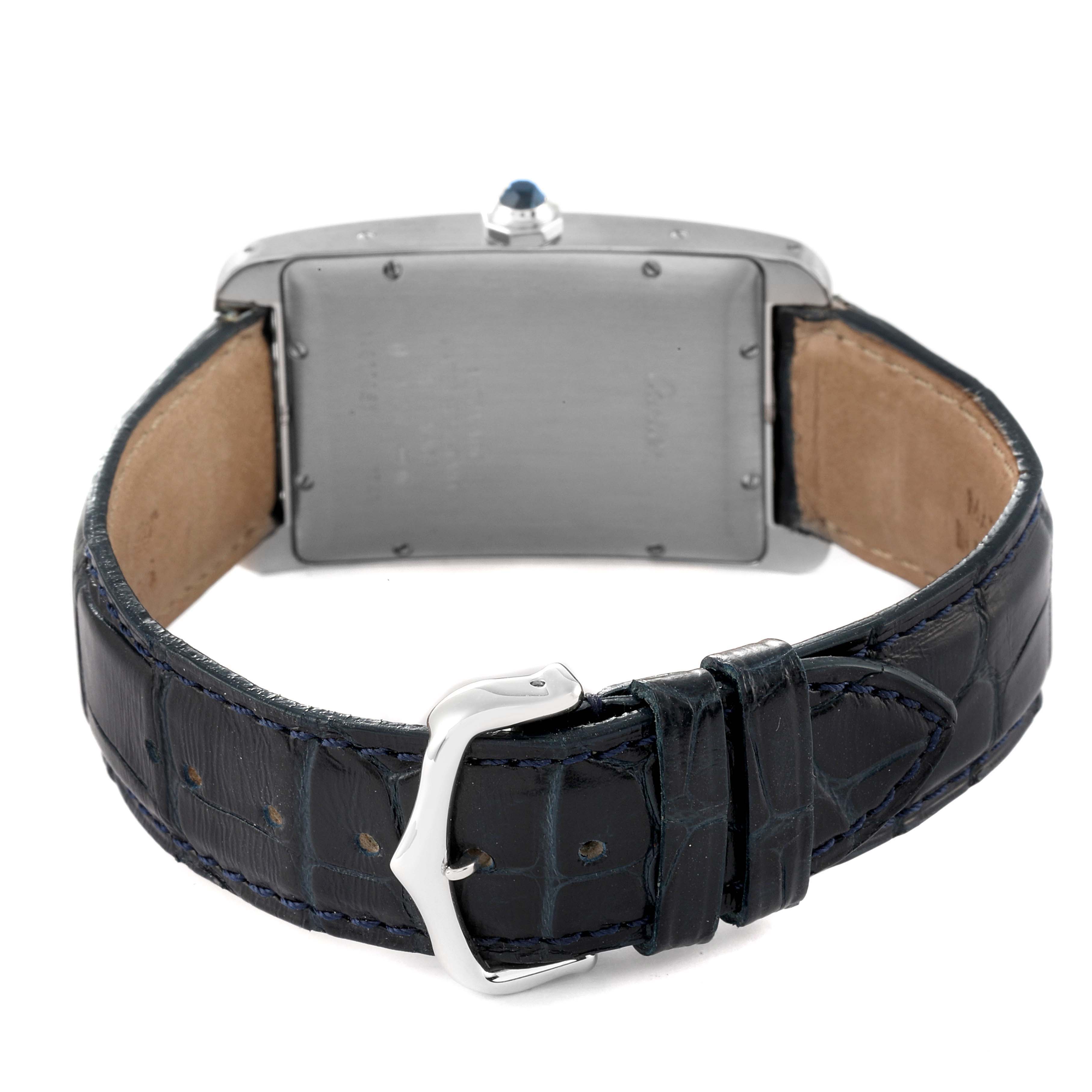 This image shows the back view of the Tank Américaine watch by Cartier, highlighting the case back, leather strap, and buckle.