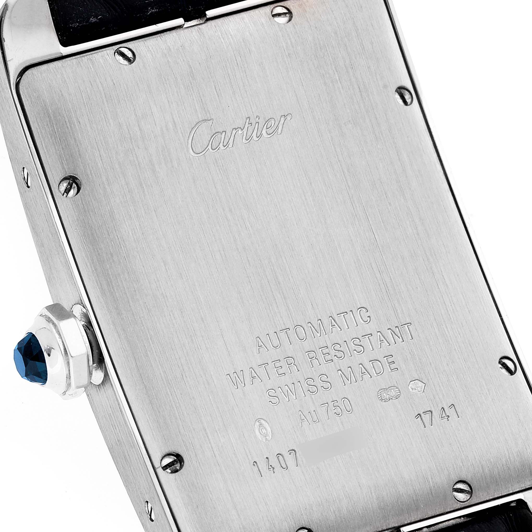 This image shows the back case and crown with a blue gem of the Tank Americaine watch by Cartier.