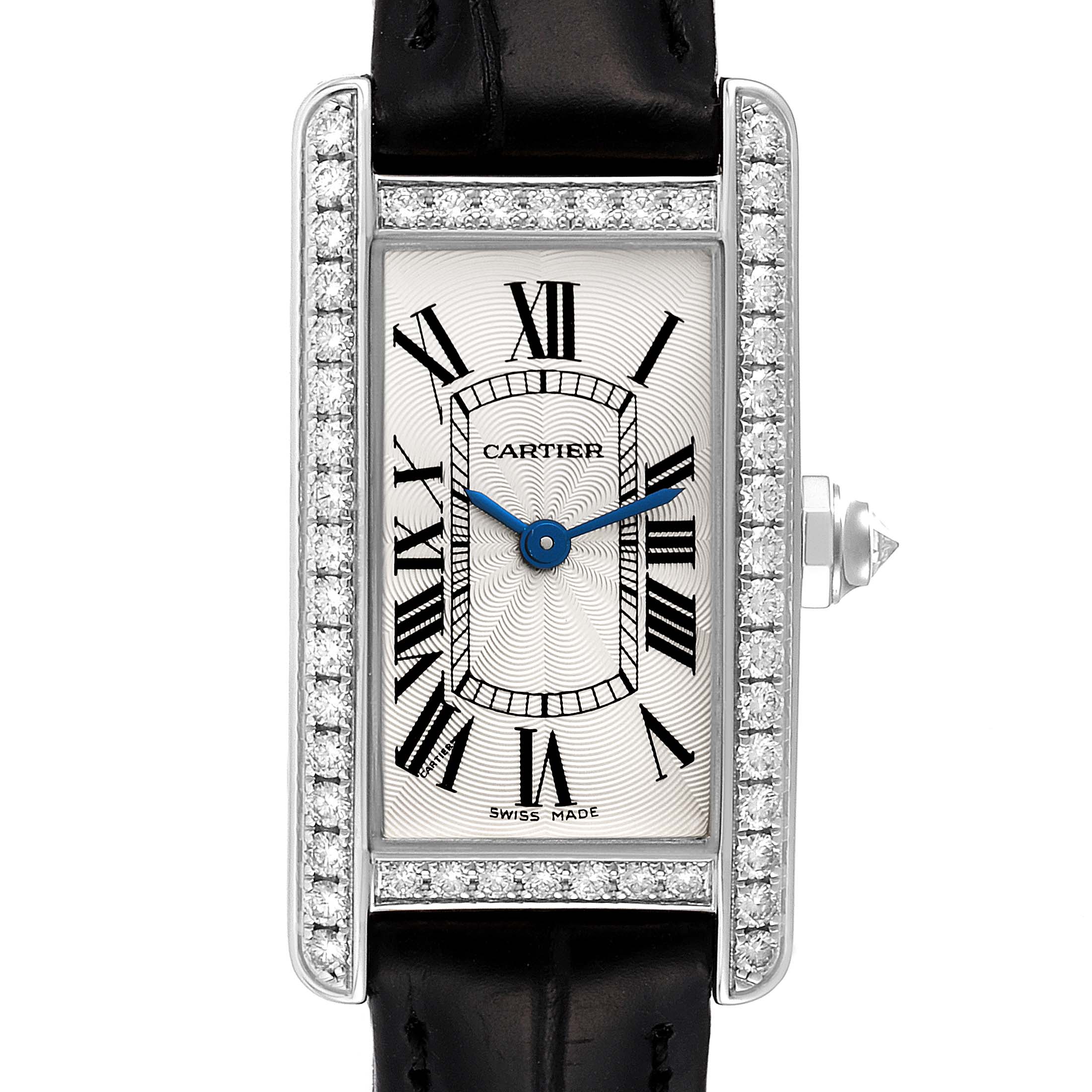 The Tank Americaine by Cartier is shown from a frontal angle, highlighting the dial, Roman numerals, and diamond-set bezel.