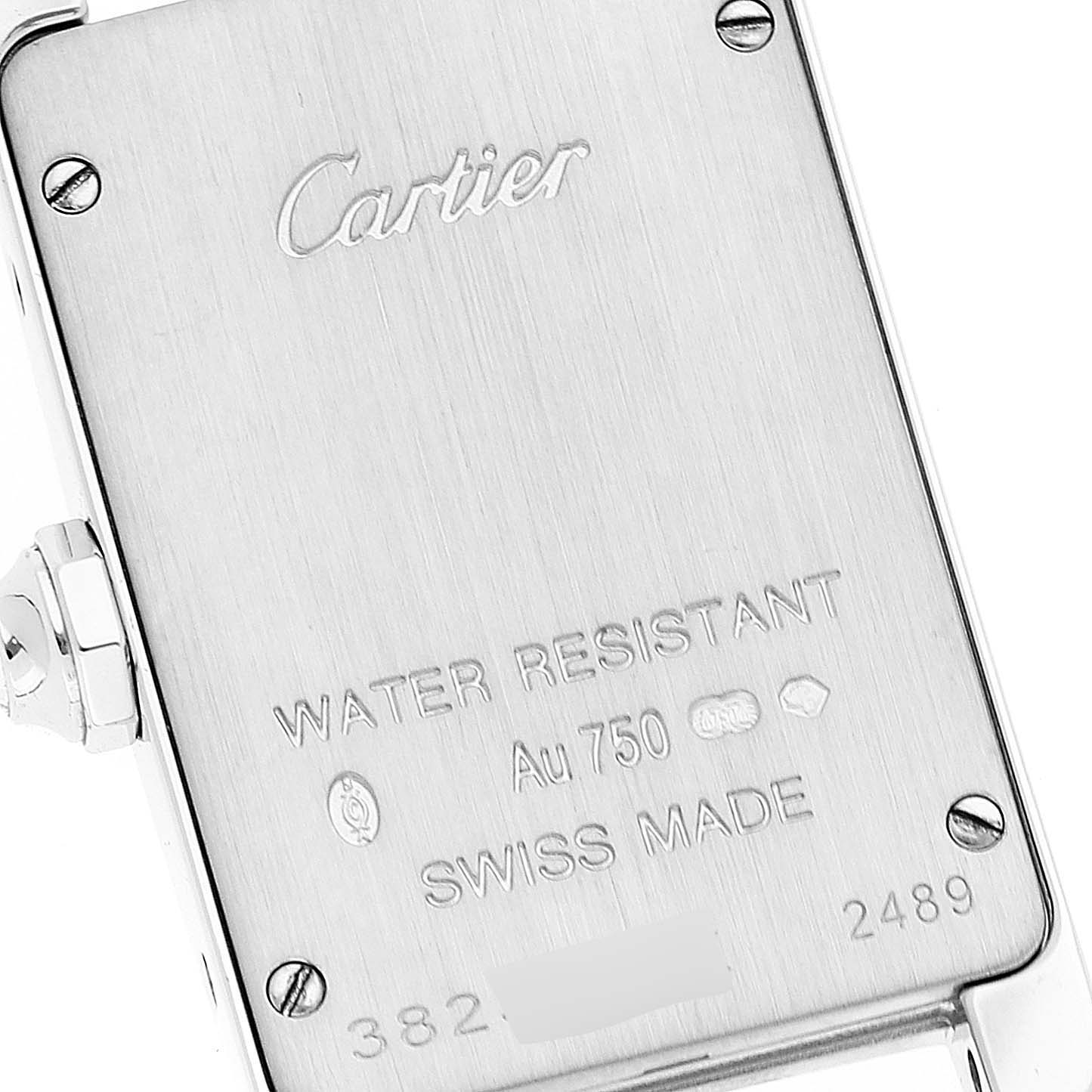 The image shows the back case of a Cartier Tank Americaine 2489 Women's White Gold Silver Dial 2489 Women's White Gold Silver Dial watch, highlighting branding and water resistance details.