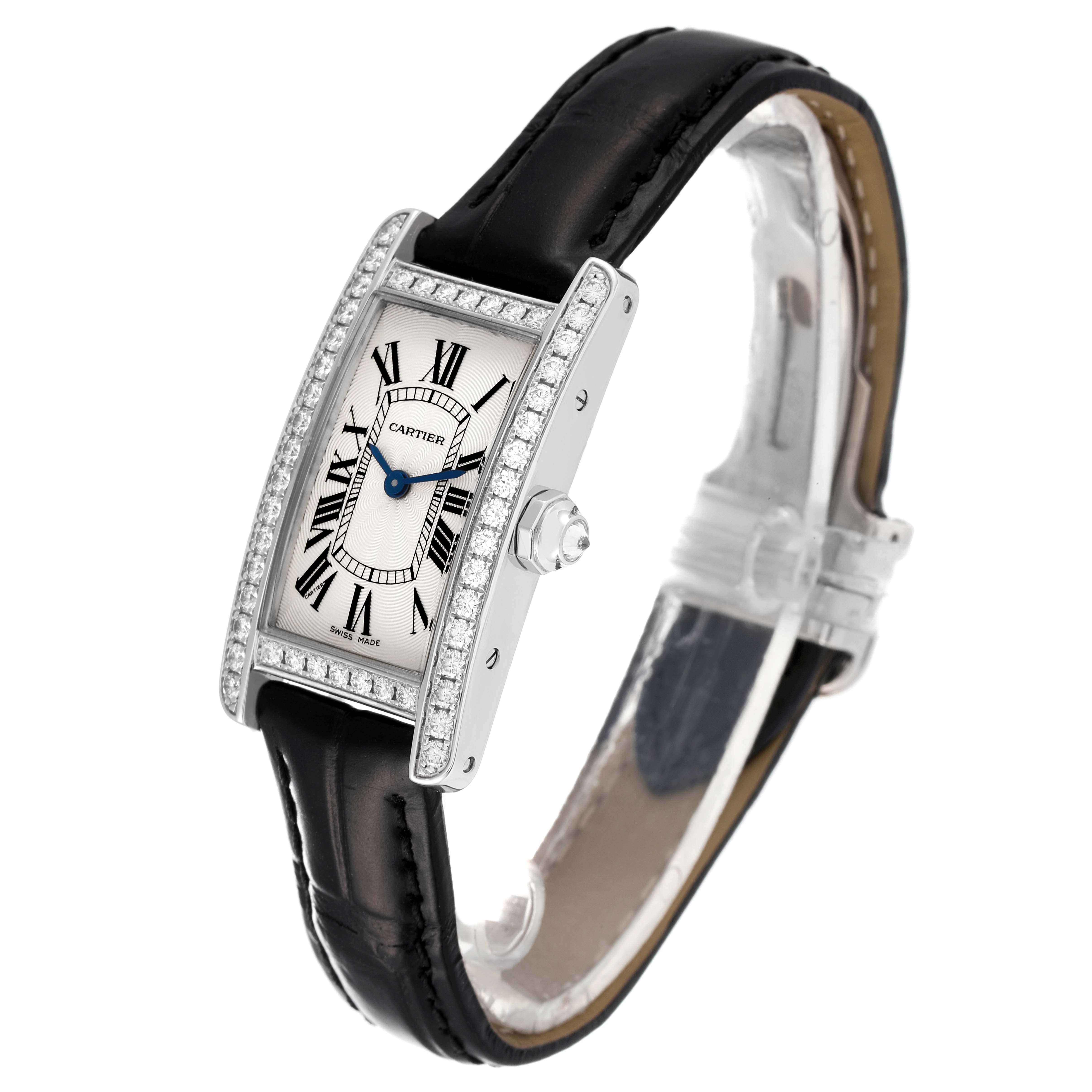 The image shows a Cartier Tank Américaine watch at a slight angle, highlighting its face, bezel, and black leather strap.